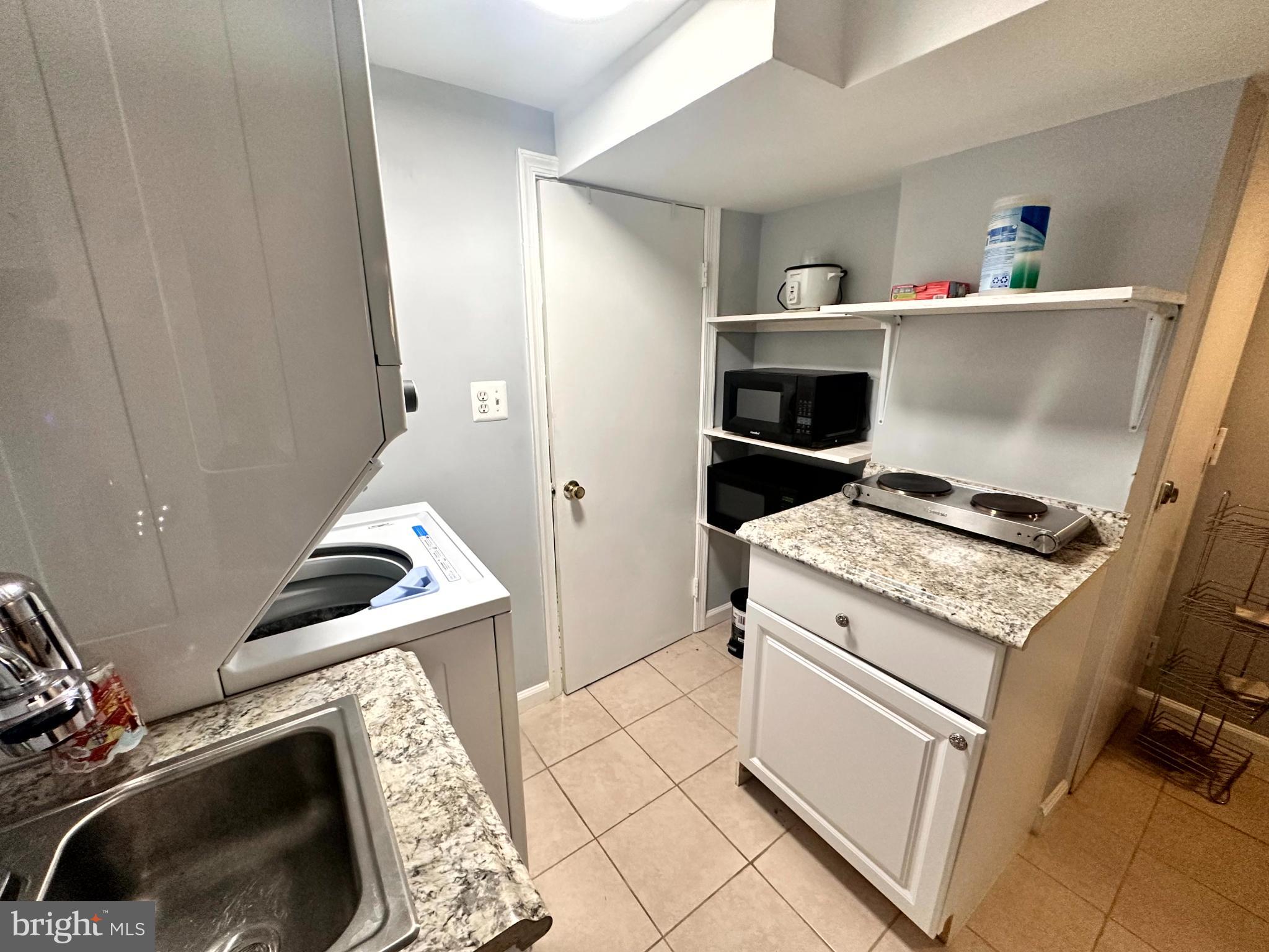 60 Q Street Northwest Washington, DC 20001 - Photo 5 of 12 Compact kitchen with modern finishes.