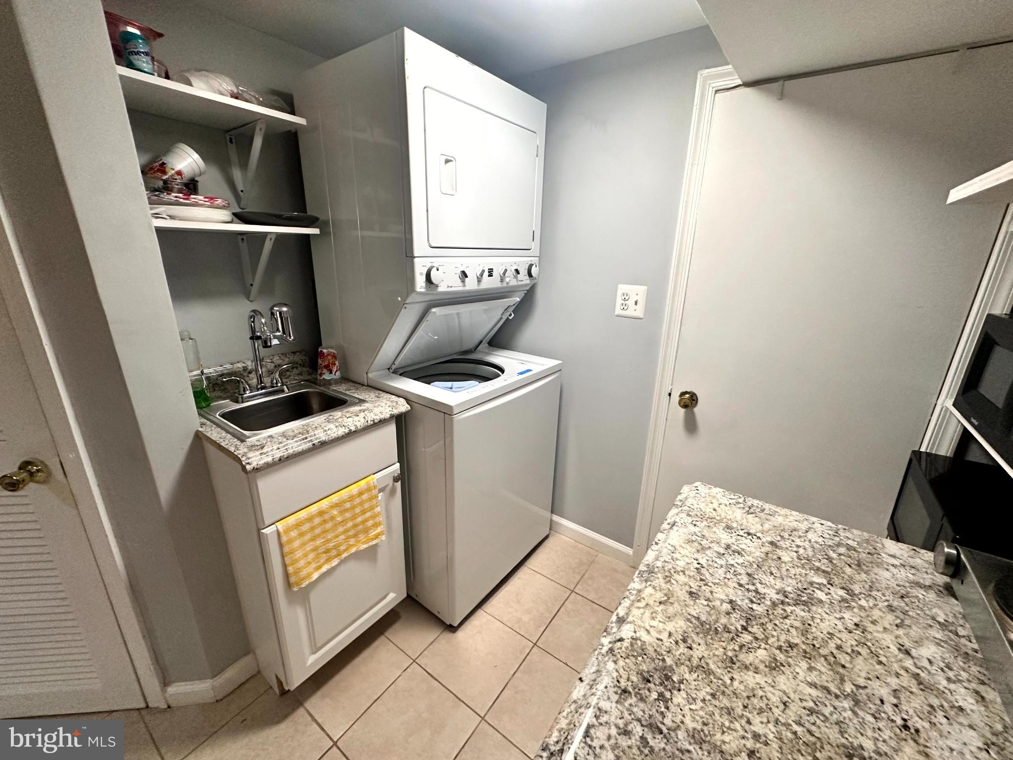 60 Q Street Northwest Washington, DC 20001 - Photo 6 of 12 Compact laundry area with modern appliances.
