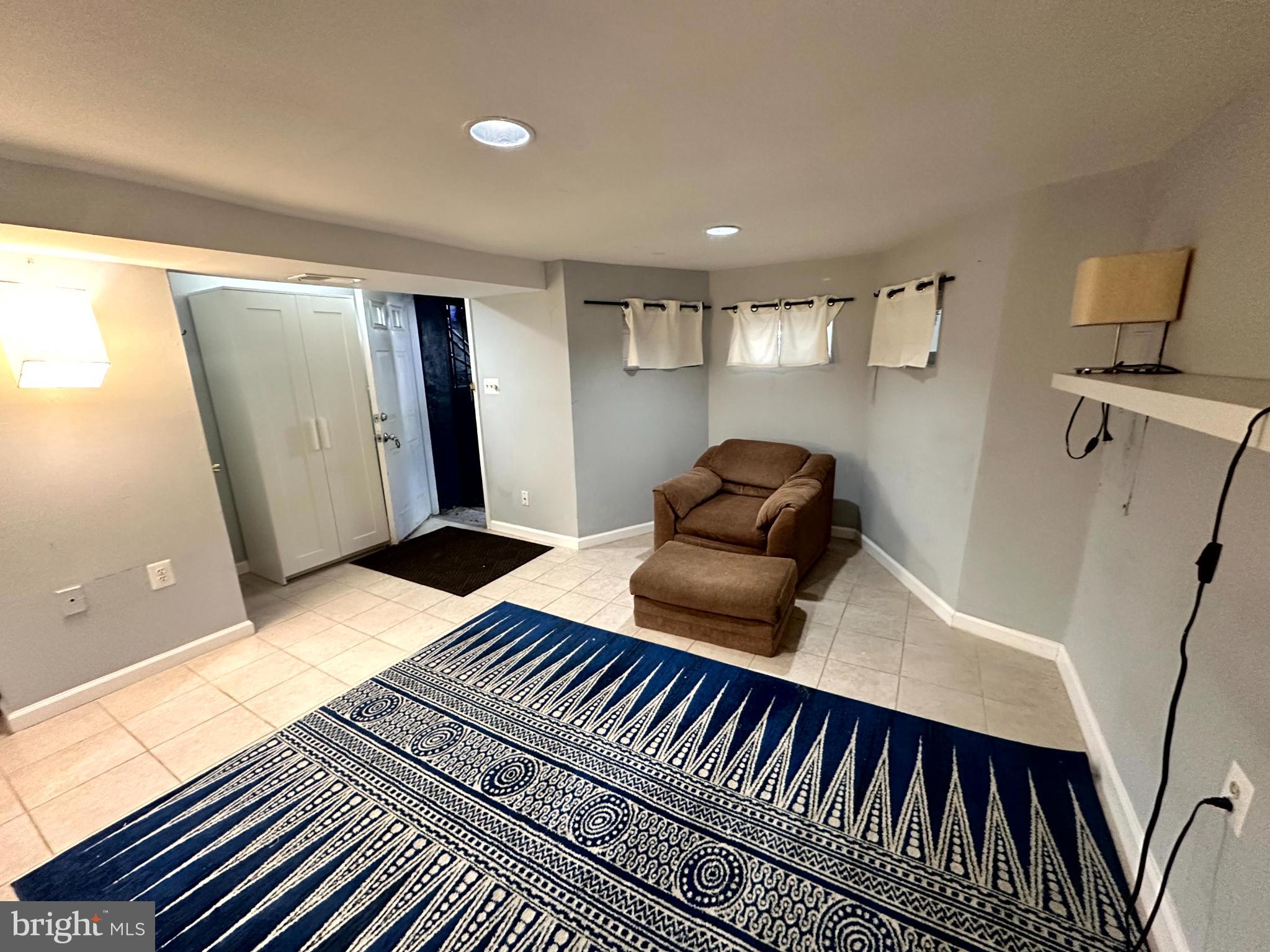 60 Q Street Northwest Washington, DC 20001 - Photo 9 of 12 Cozy basement retreat with modern flair.