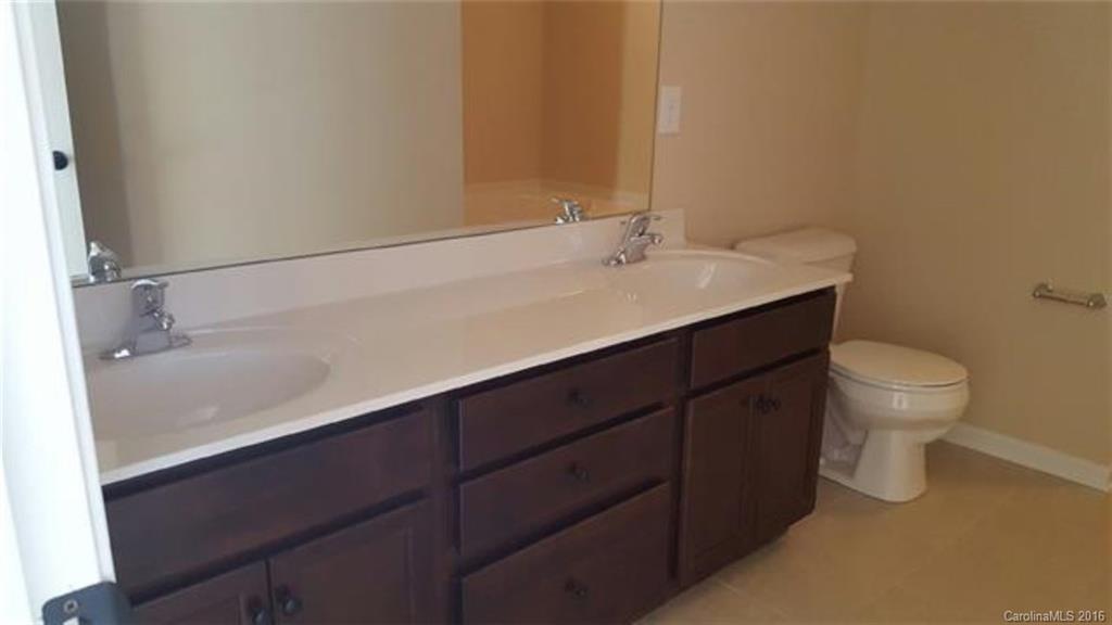 617 School House Lane, Unit 29 Fort Mill, SC 29708 - Photo 11 of 13 a bathroom with a sink and a toilet