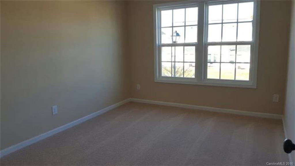 617 School House Lane, Unit 29 Fort Mill, SC 29708 - Photo 7 of 13 an empty room with a window