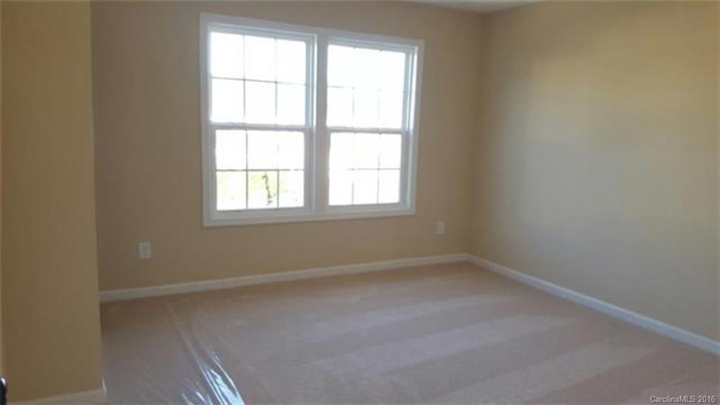 617 School House Lane, Unit 29 Fort Mill, SC 29708 - Photo 8 of 13 an empty room with a window