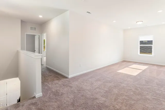 a bathroom with a double vanity sink a mirror and a shower