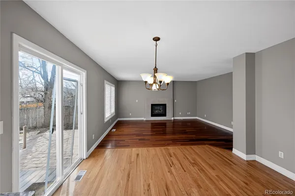 a view of livingroom with hardwood floor and ceiling window