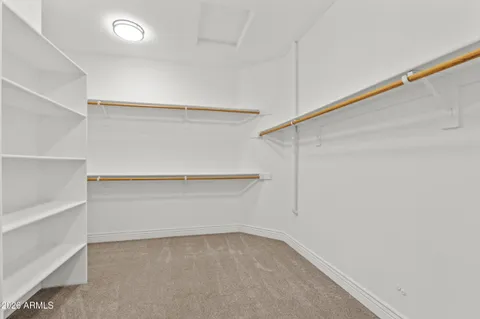 a view of an empty walk in closet