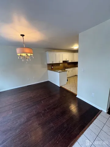 an empty room with wooden floor