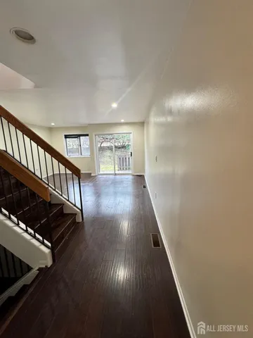 a view of entryway with wooden floor