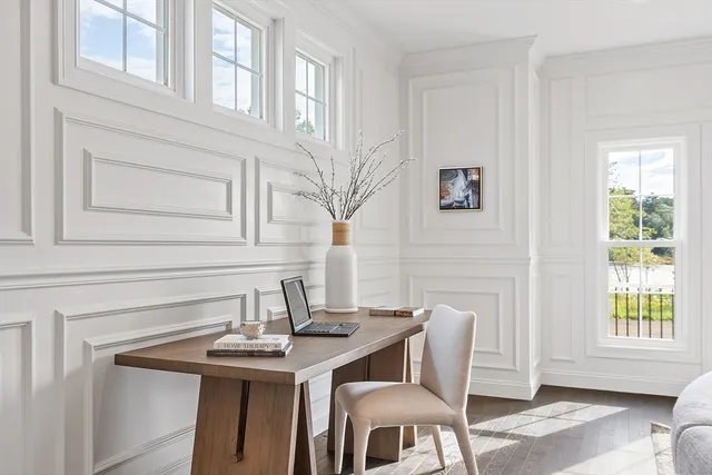 a view of a dining room with furniture and window