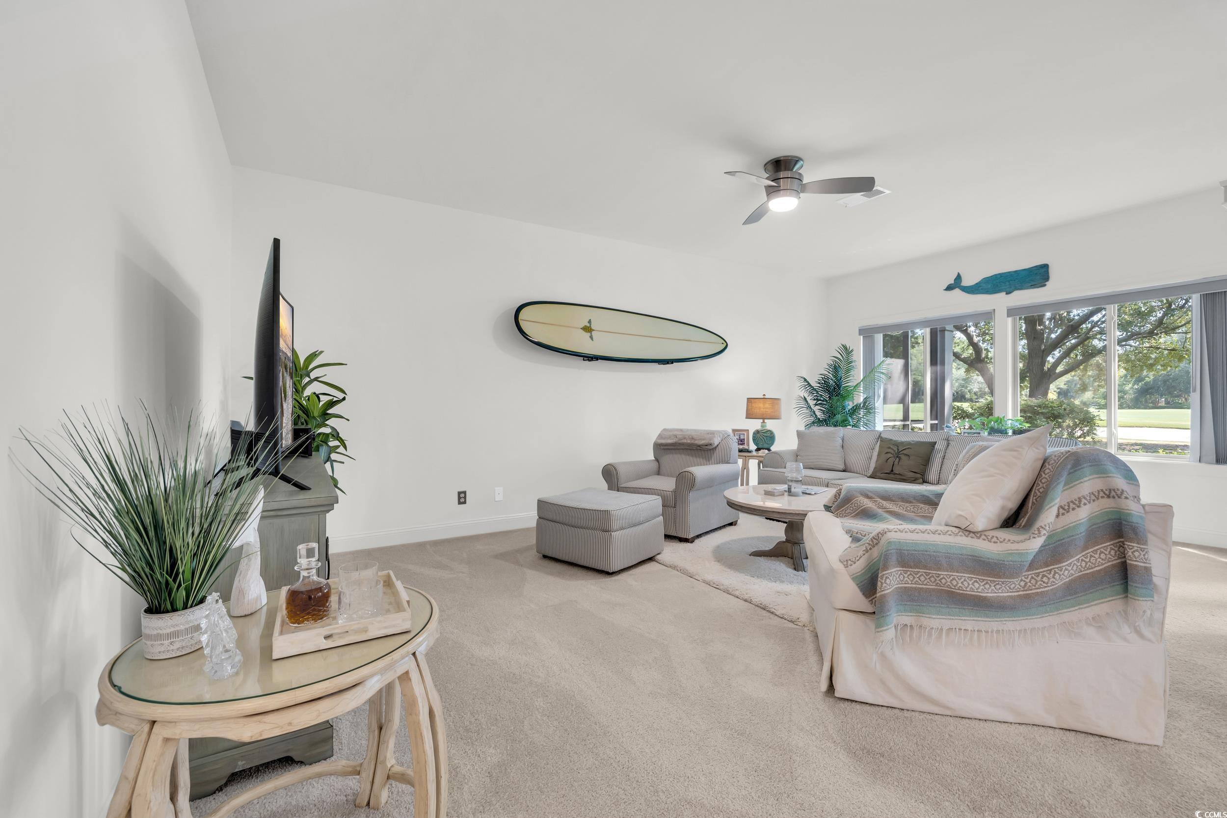 141 Twelve Oaks Drive, Unit 5 Pawleys Island, SC 29585 - Photo 14 of 37 Carpeted living room featuring baseboards and ceiling fan