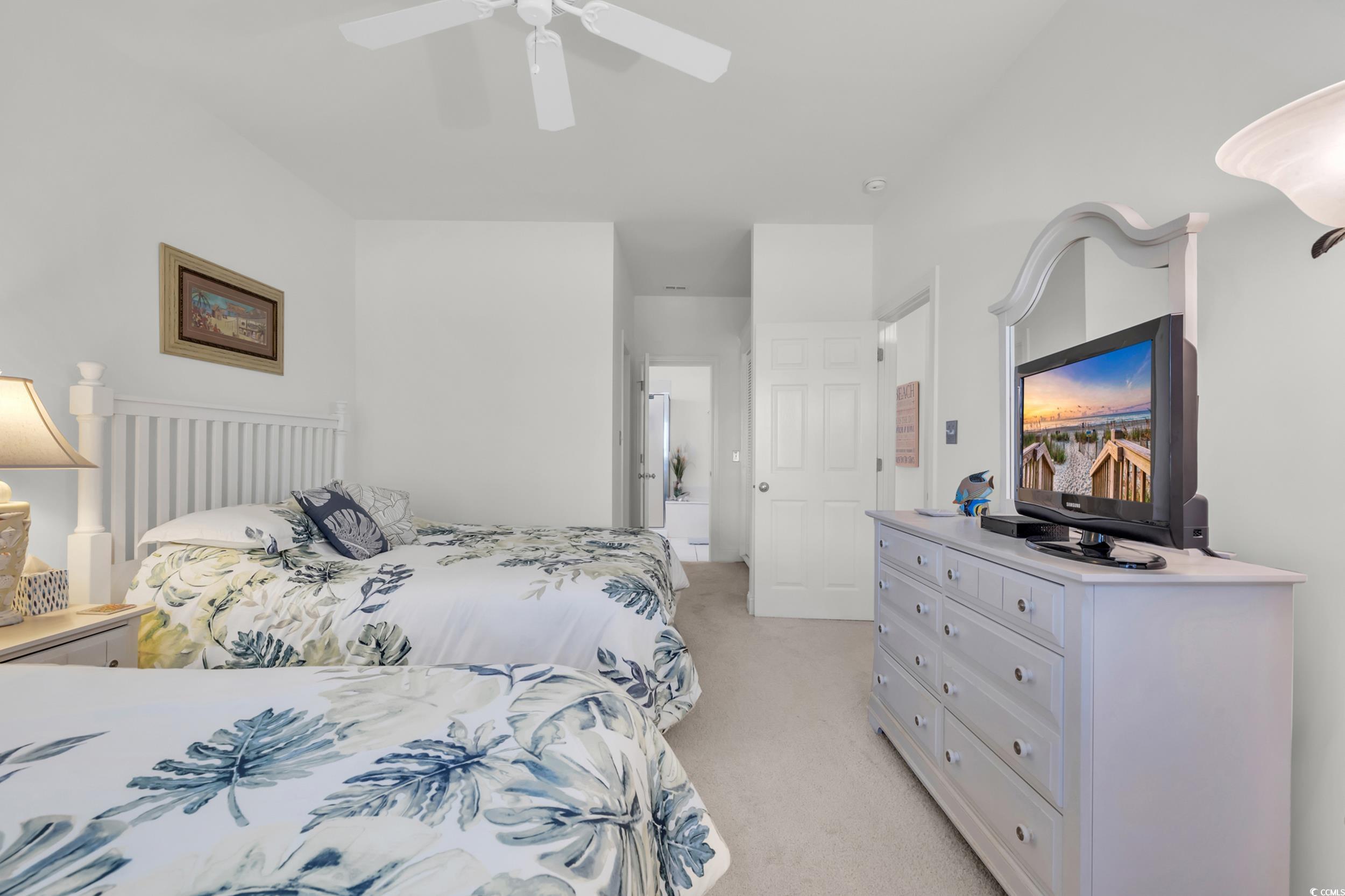 141 Twelve Oaks Drive, Unit 5 Pawleys Island, SC 29585 - Photo 18 of 37 Bedroom featuring light carpet and a ceiling fan