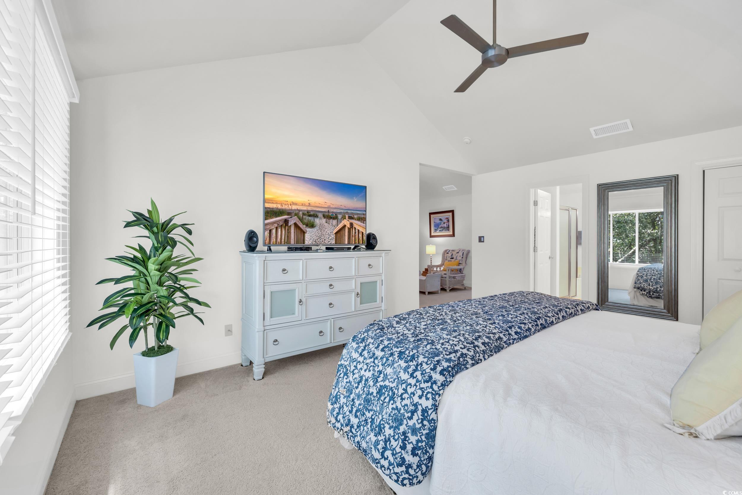 141 Twelve Oaks Drive, Unit 5 Pawleys Island, SC 29585 - Photo 23 of 37 Bedroom featuring light carpet, ceiling fan, and high vaulted ceiling