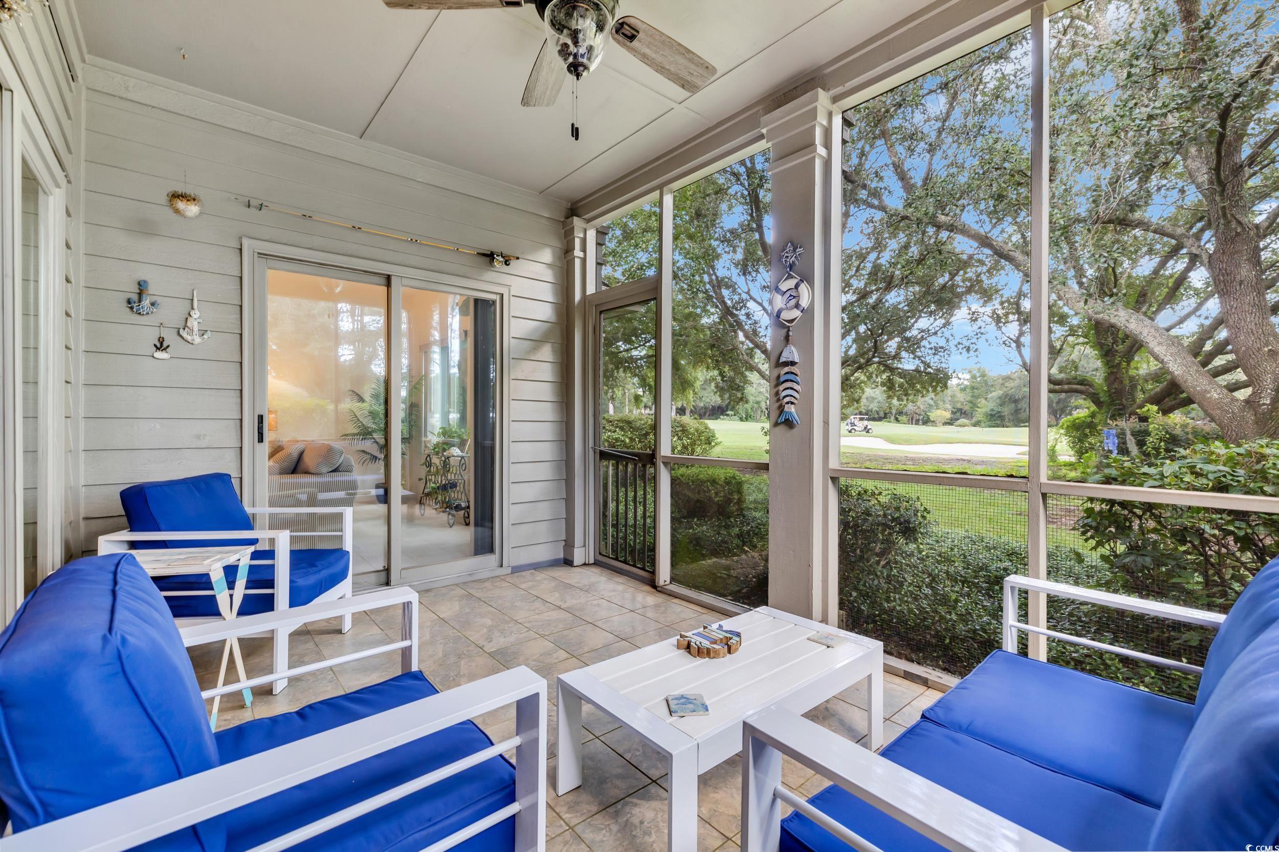 141 Twelve Oaks Drive, Unit 5 Pawleys Island, SC 29585 - Photo 30 of 37 Sunroom / solarium featuring an outdoor hangout area and a ceiling fan