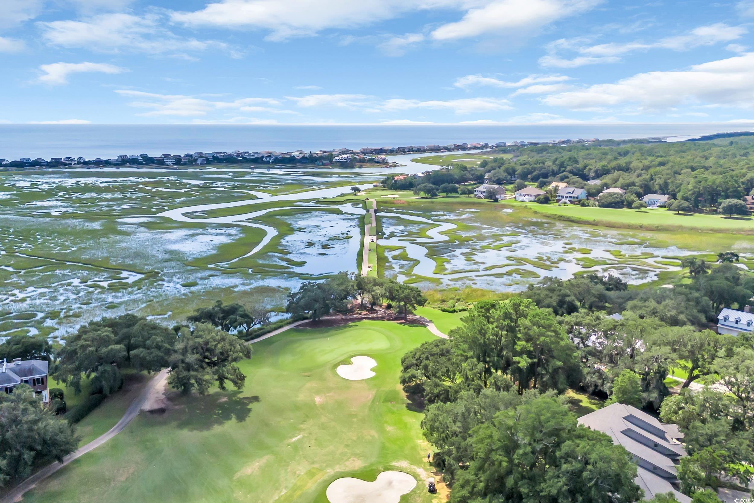 141 Twelve Oaks Drive, Unit 5 Pawleys Island, SC 29585 - Photo 35 of 37 Aerial view of property's location featuring a nearby body of water, a local golf course, and nearby suburban area
