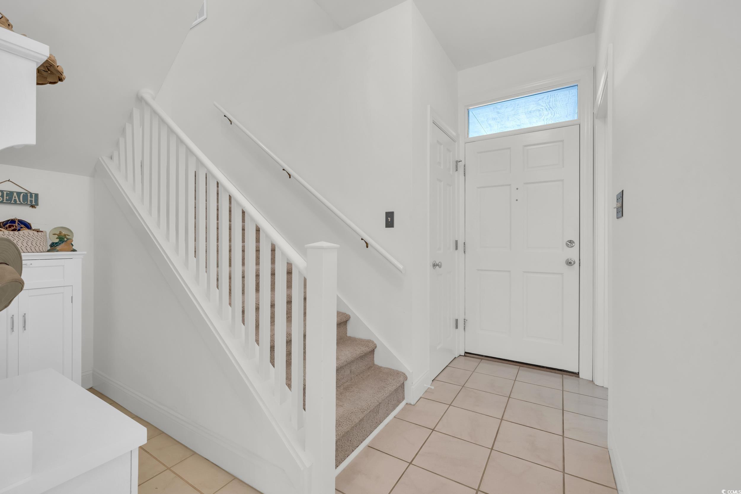 141 Twelve Oaks Drive, Unit 5 Pawleys Island, SC 29585 - Photo 4 of 37 Foyer featuring stairs and light tile patterned floors