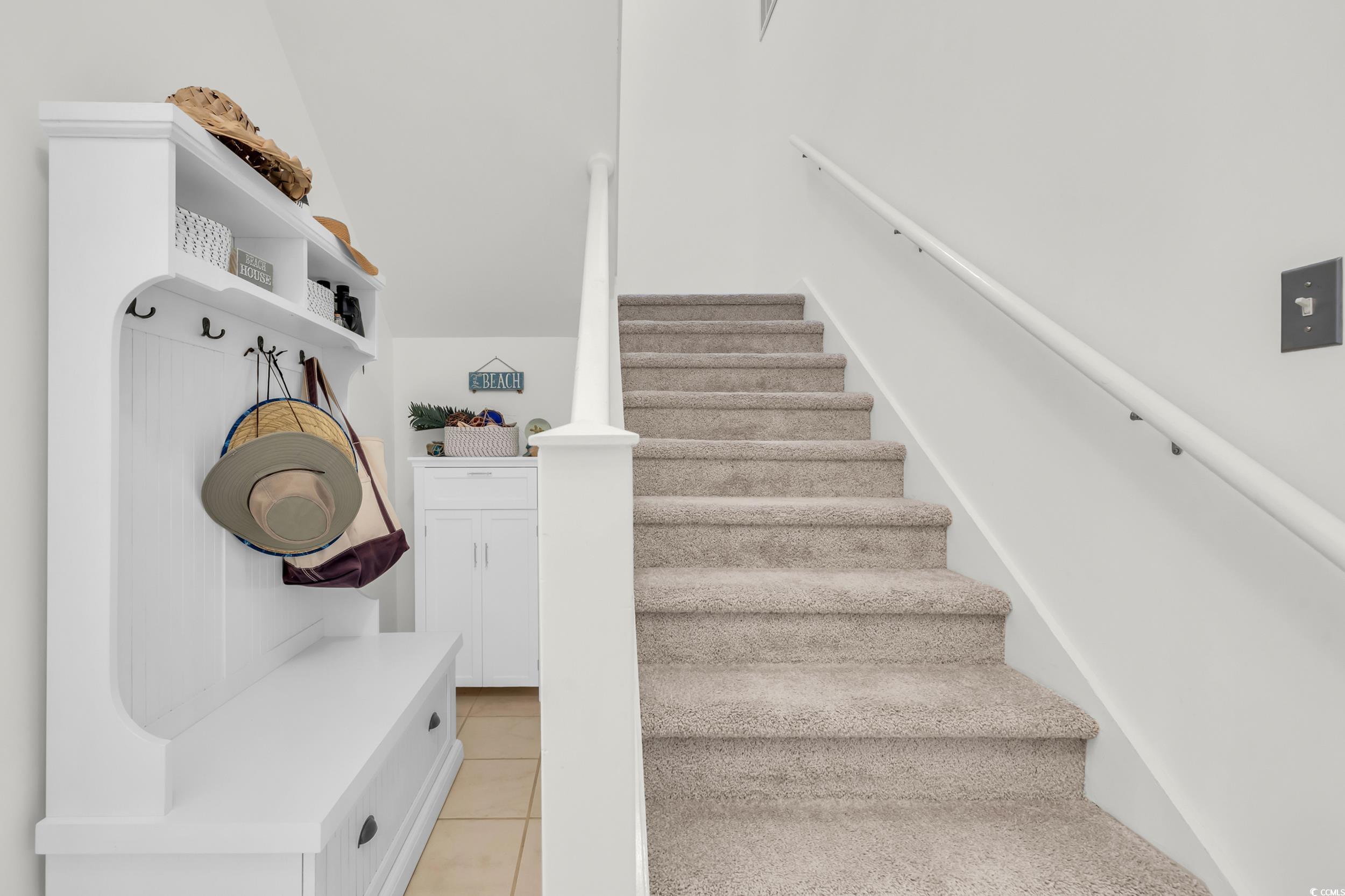 141 Twelve Oaks Drive, Unit 5 Pawleys Island, SC 29585 - Photo 5 of 37 Stairway with tile patterned floors