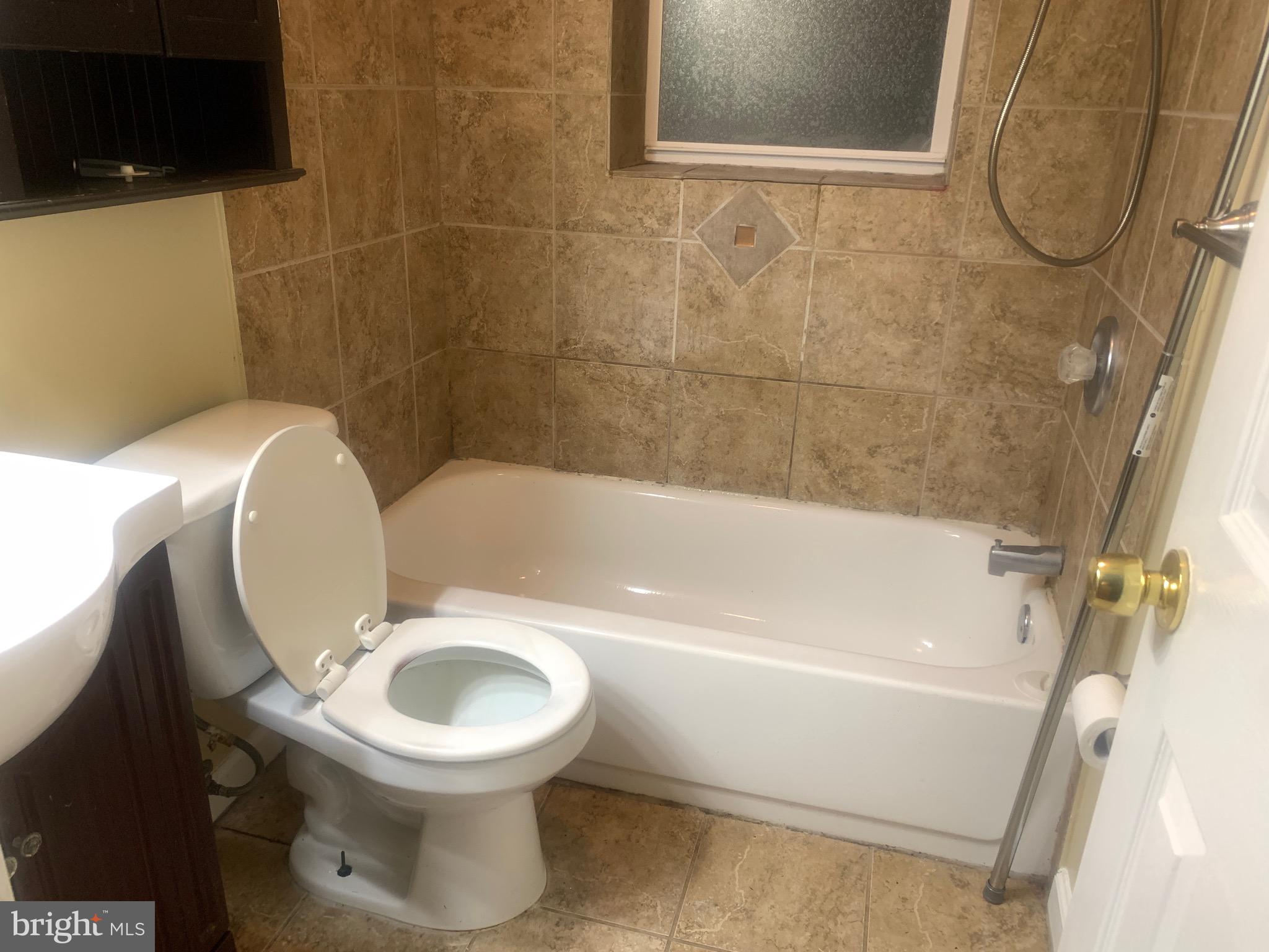 5393 Nelson Point Road Indian Head, MD 20640 - Photo 14 of 23 a bathroom with a toilet and a bathtub