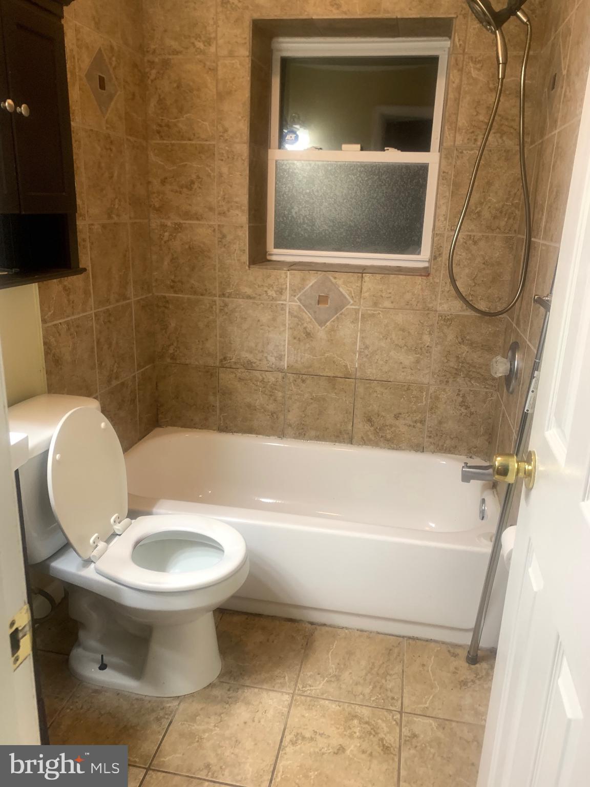 5393 Nelson Point Road Indian Head, MD 20640 - Photo 15 of 23 a bathroom with a toilet and a bathtub