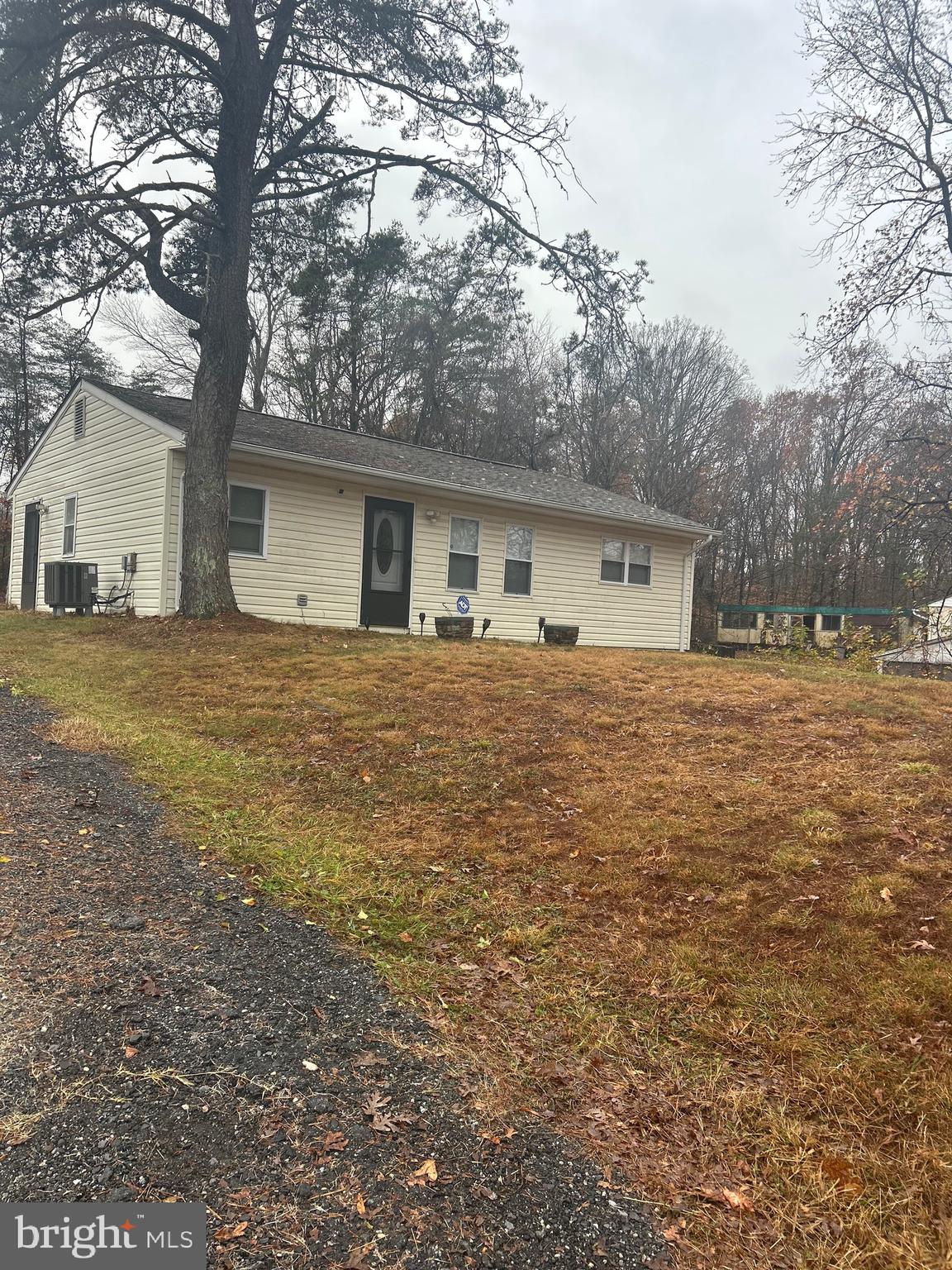 5393 Nelson Point Road Indian Head, MD 20640 - Photo 2 of 23 a front view of a house with a yard and trees