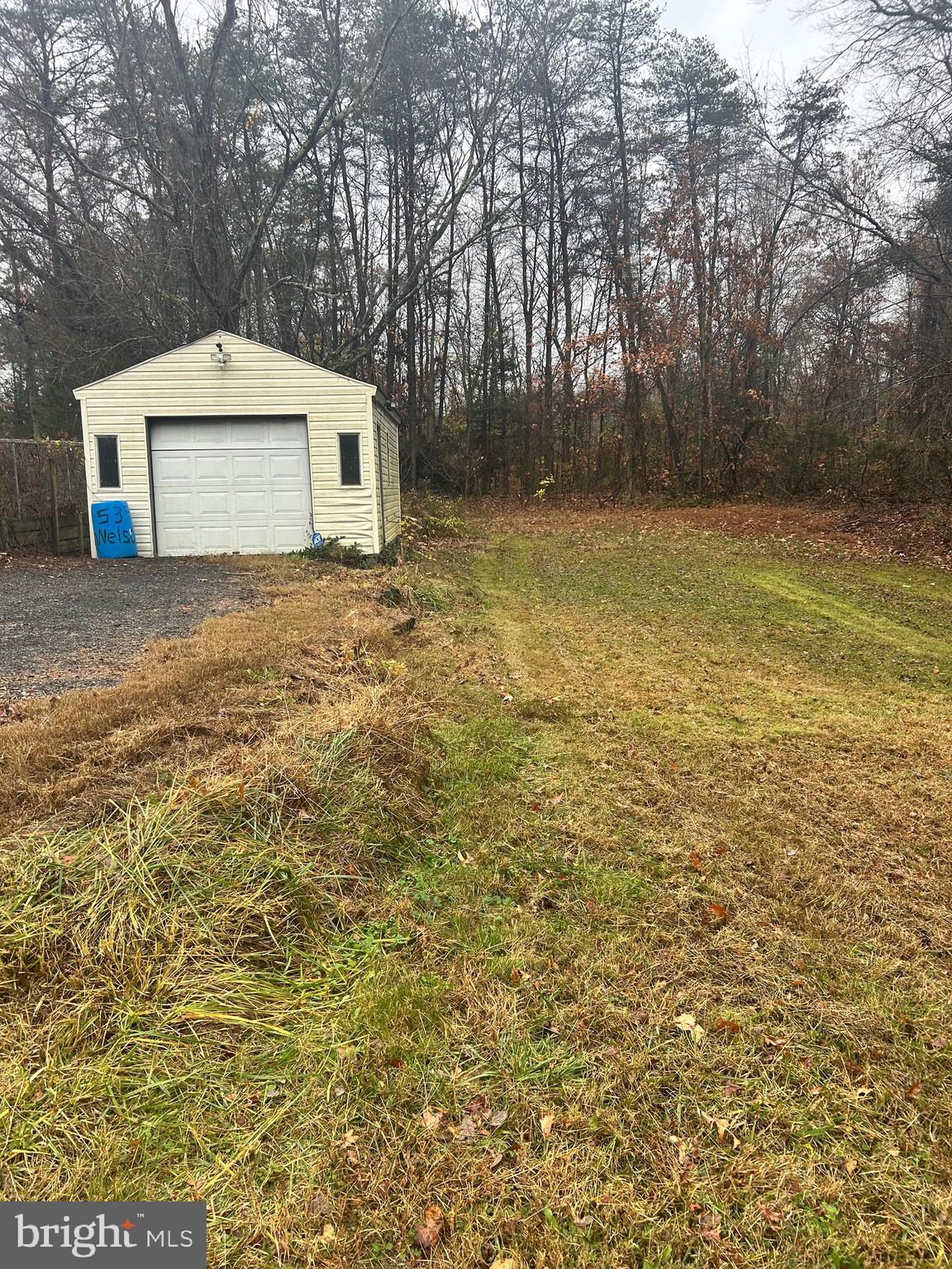 5393 Nelson Point Road Indian Head, MD 20640 - Photo 23 of 23 a front view of a house with a yard and garage