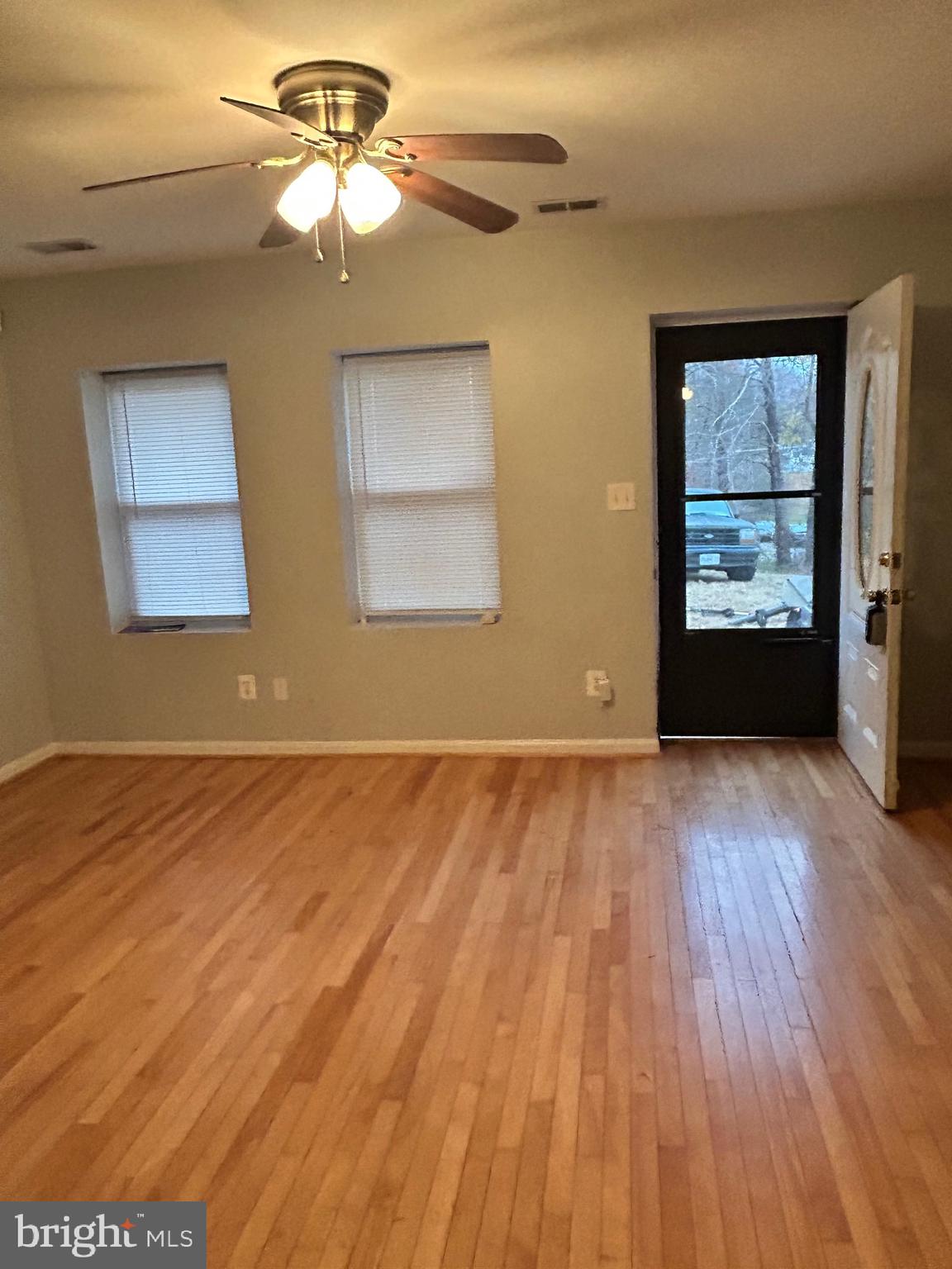 5393 Nelson Point Road Indian Head, MD 20640 - Photo 3 of 23 a view of empty room with wooden floor and fan