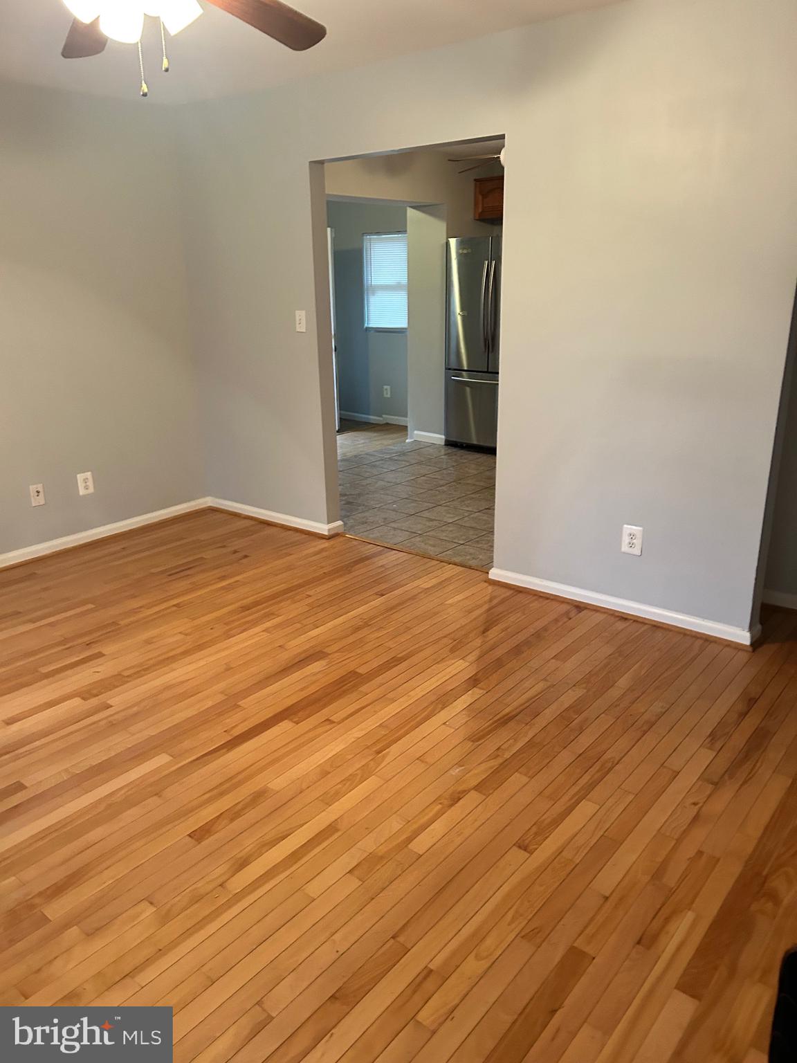 5393 Nelson Point Road Indian Head, MD 20640 - Photo 5 of 23 an empty room with wooden floor and door