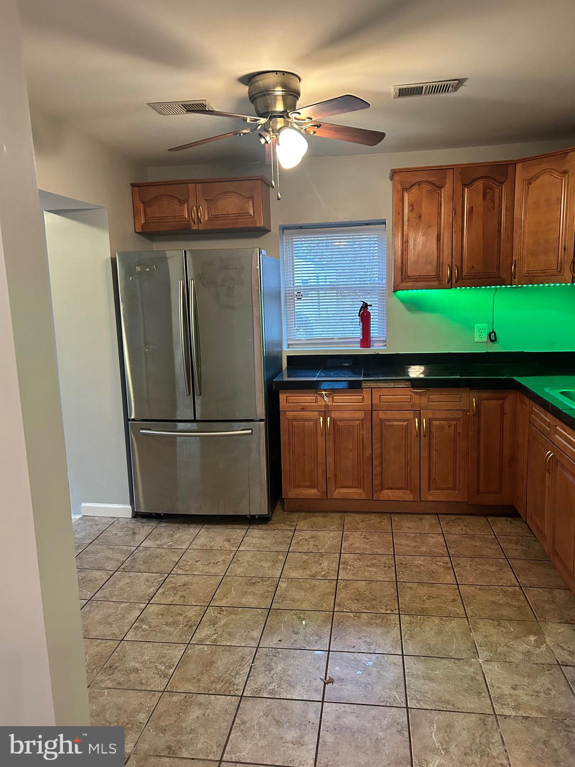 5393 Nelson Point Road Indian Head, MD 20640 - Photo 6 of 23 a kitchen with stainless steel appliances granite countertop a refrigerator a sink and a stove