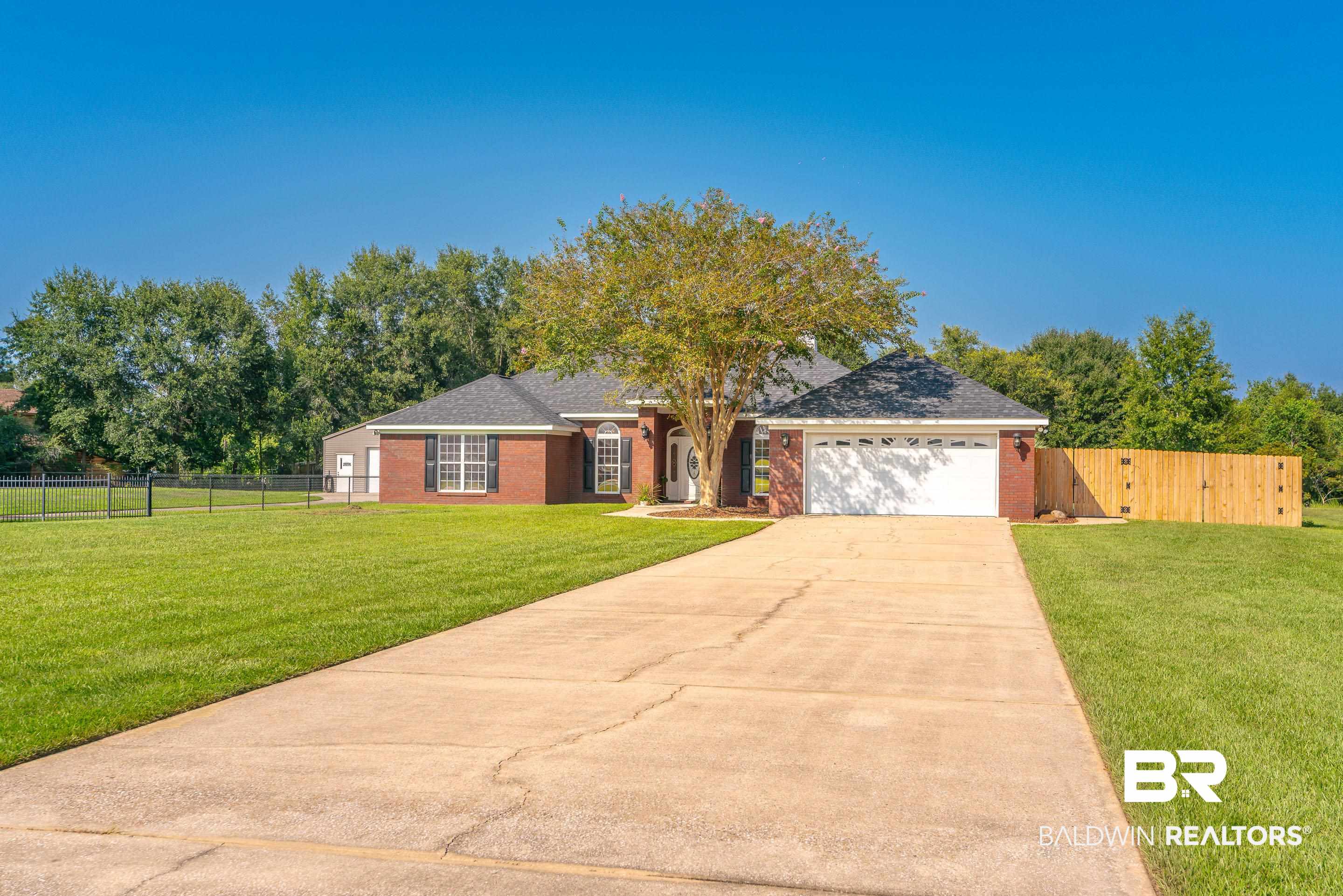 9477 Deerfield Drive Irvington, AL 36544 - Photo 53 of 58 Ranch-style house with a garage and a front yard