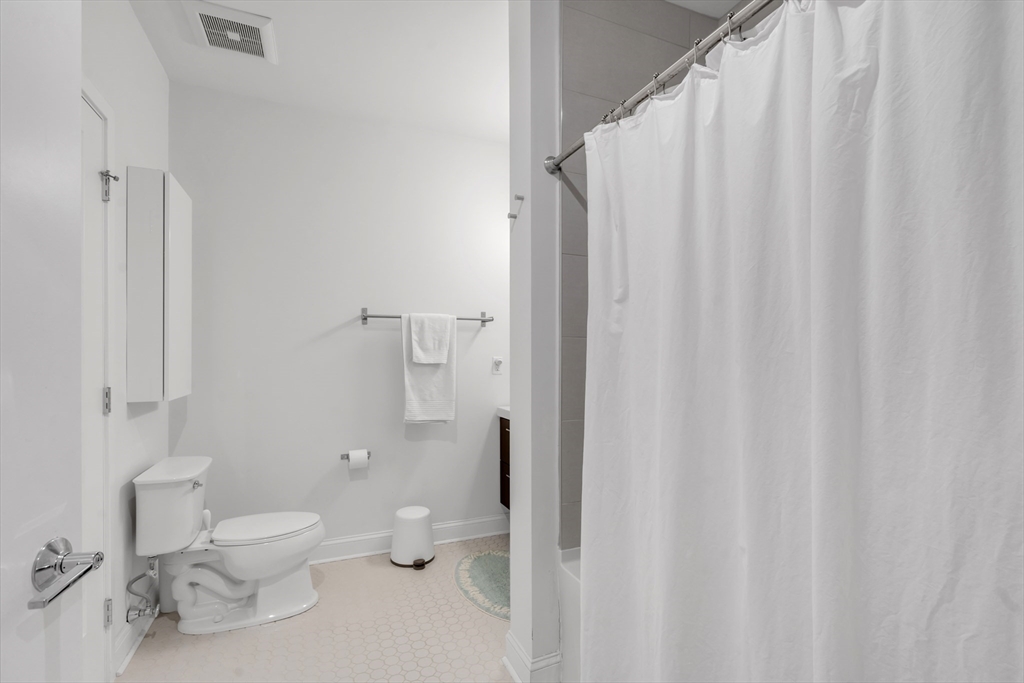 1 Brook Road, Unit 215 Quincy, MA 02169 - Photo 13 of 24 a bathroom with a toilet and a shower