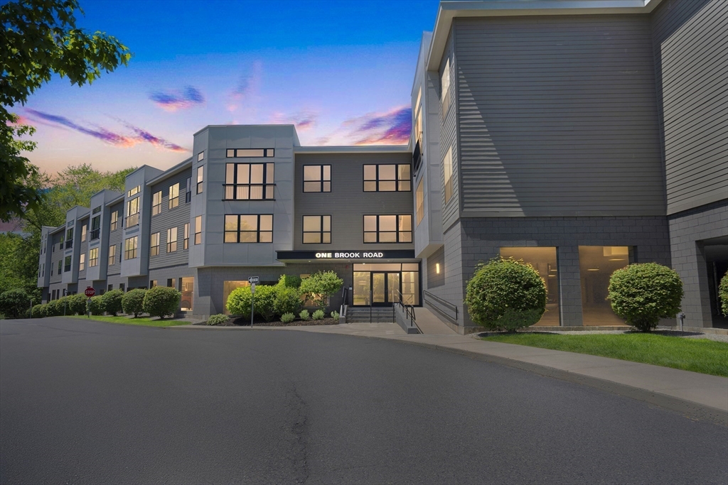 1 Brook Road, Unit 215 Quincy, MA 02169 - Photo 20 of 24 a front view of a building with garden