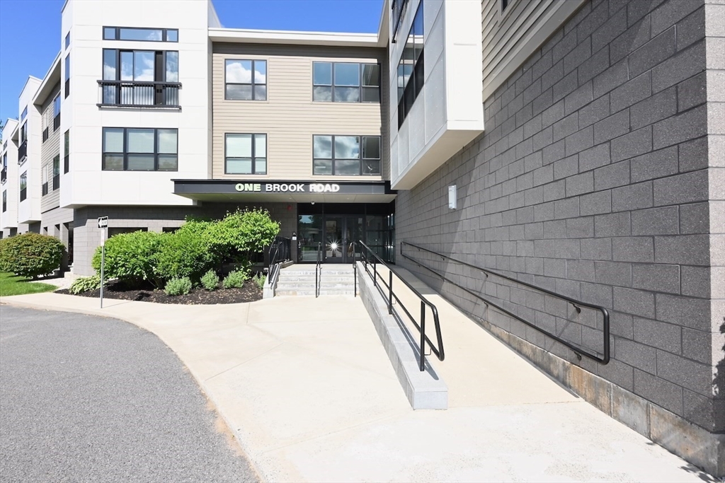 1 Brook Road, Unit 215 Quincy, MA 02169 - Photo 22 of 24 a view of a building from a balcony