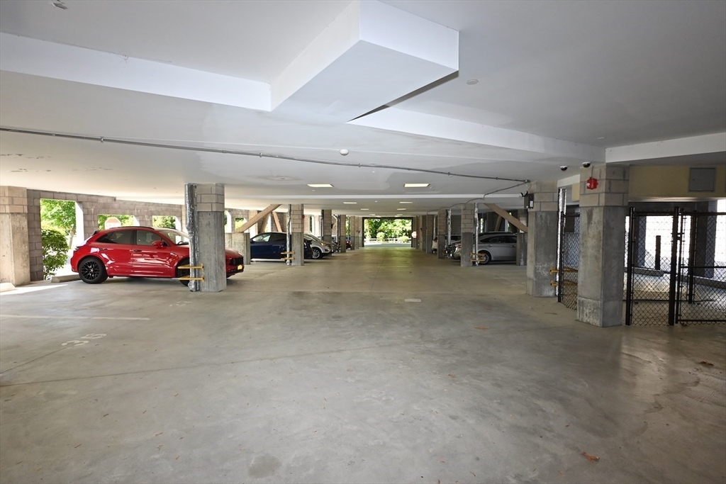 1 Brook Road, Unit 215 Quincy, MA 02169 - Photo 23 of 24 a car parked in parking garage