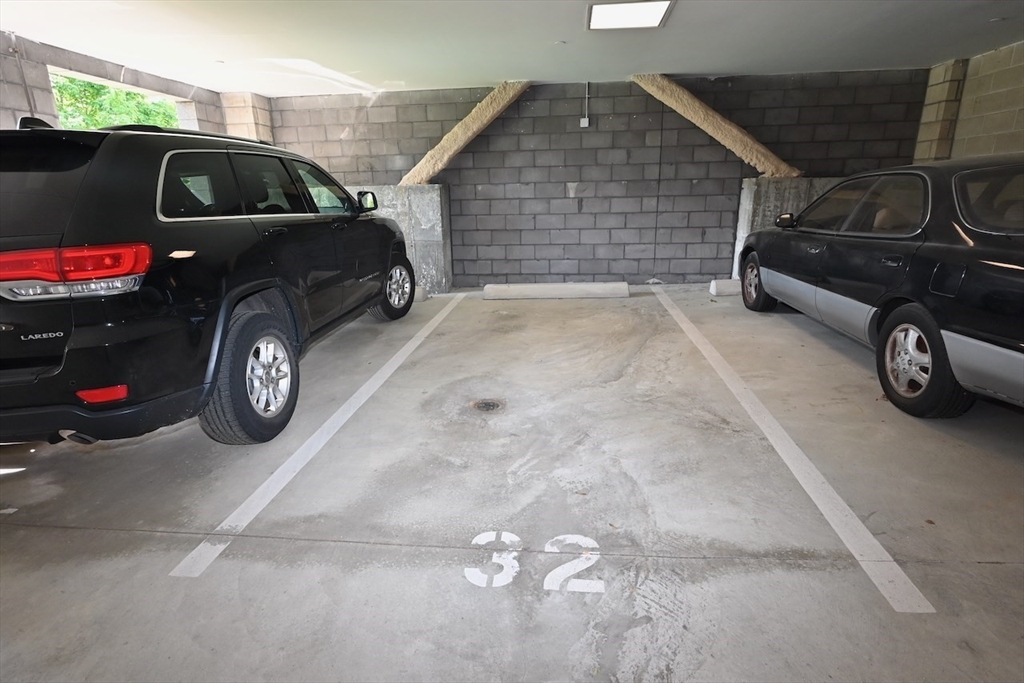1 Brook Road, Unit 215 Quincy, MA 02169 - Photo 24 of 24 a car parked in front of a house