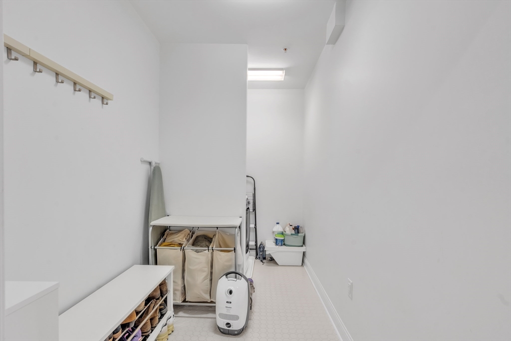 1 Brook Road, Unit 215 Quincy, MA 02169 - Photo 4 of 24 a view of storage and utility room with two windows