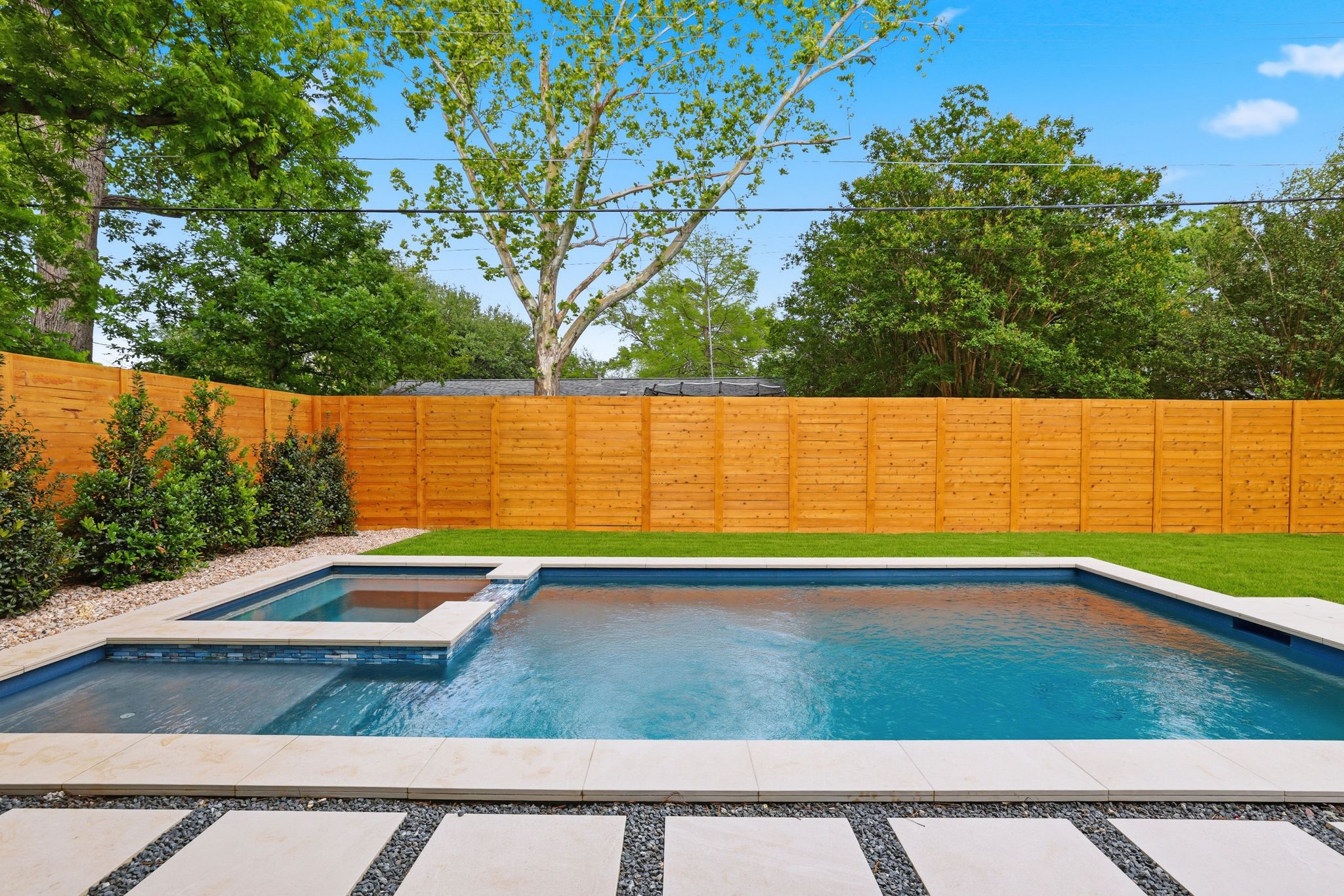 6611 Lexington Road Austin, TX 78757 - Photo 35 of 37 Contemporary backyard featuring a rectangular swimming pool with integrated spa