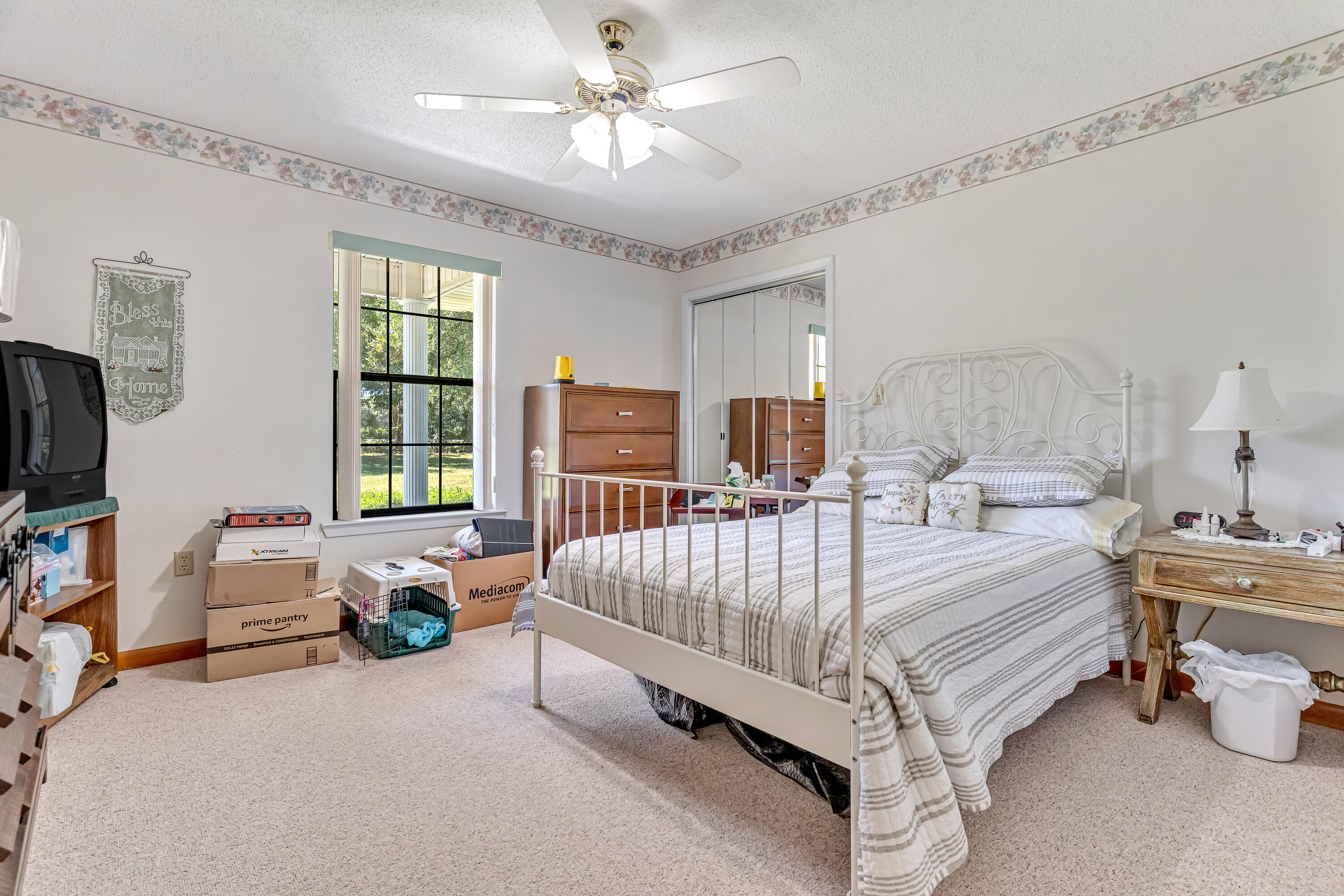 1401 Greenwood Road Baker, FL 32531 - Photo 11 of 61 a bed room with a bed and a chandelier