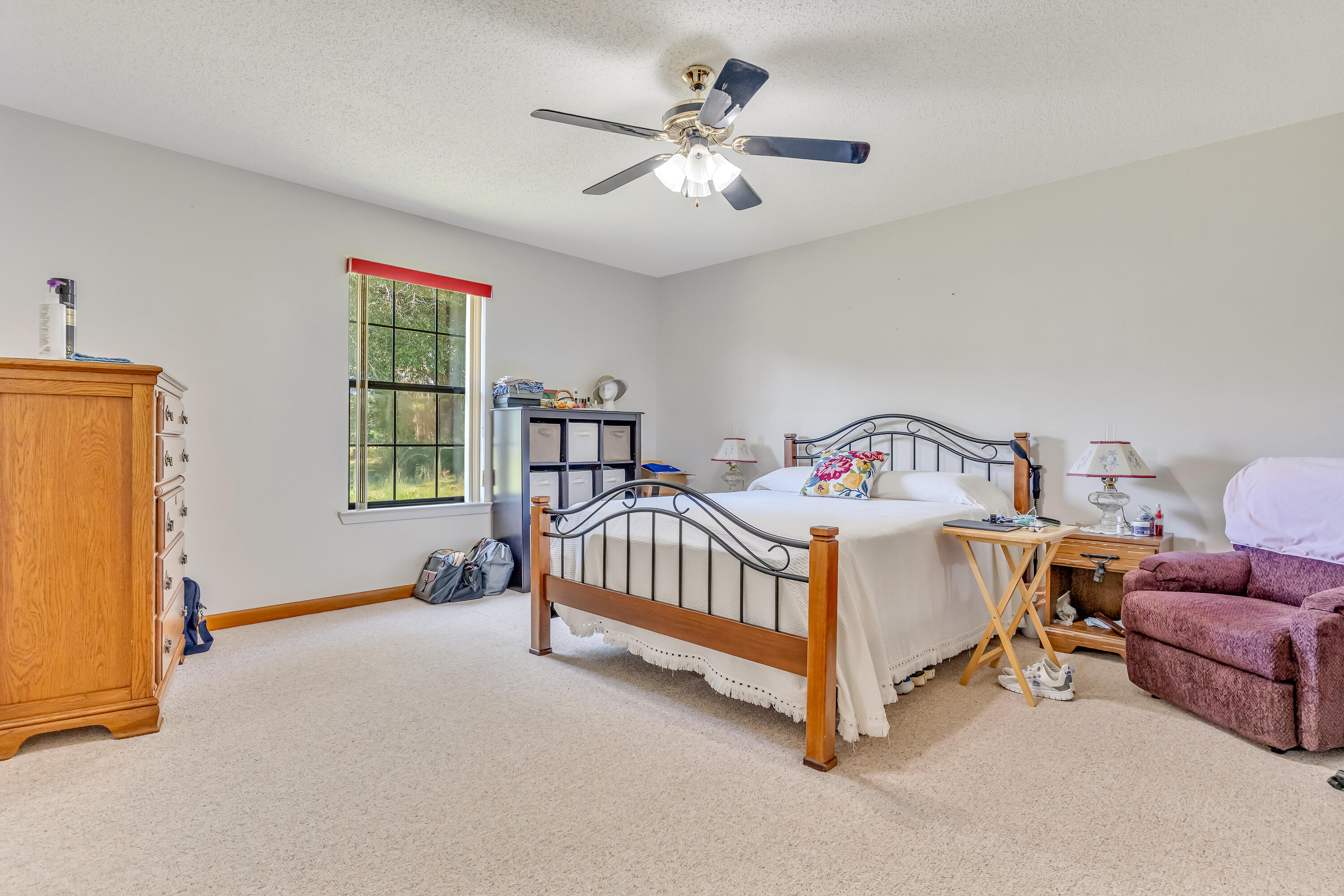 1401 Greenwood Road Baker, FL 32531 - Photo 15 of 61 a white bed sitting in a bedroom next to a window