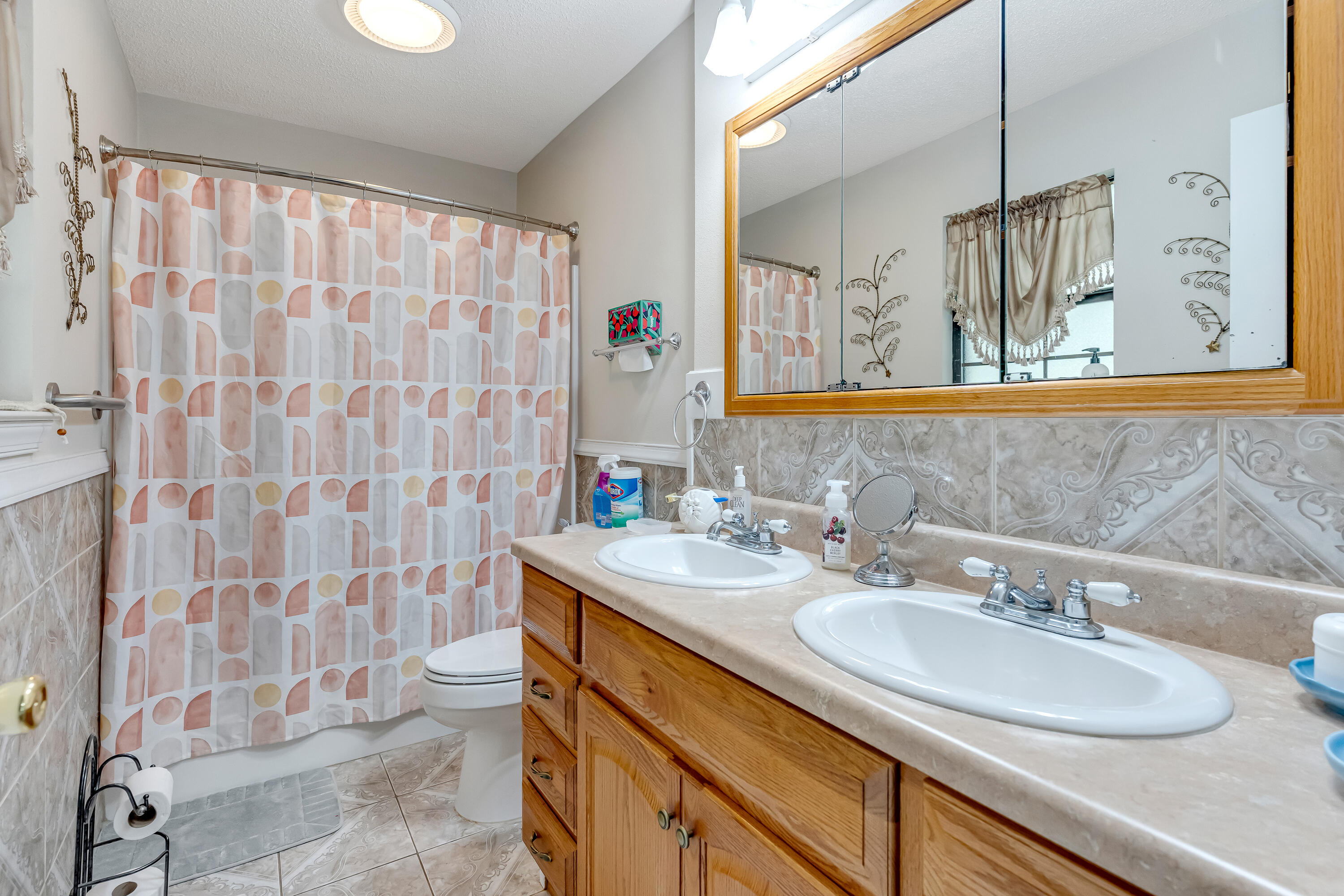 1401 Greenwood Road Baker, FL 32531 - Photo 19 of 61 a bathroom with a sink a vanity and a mirror