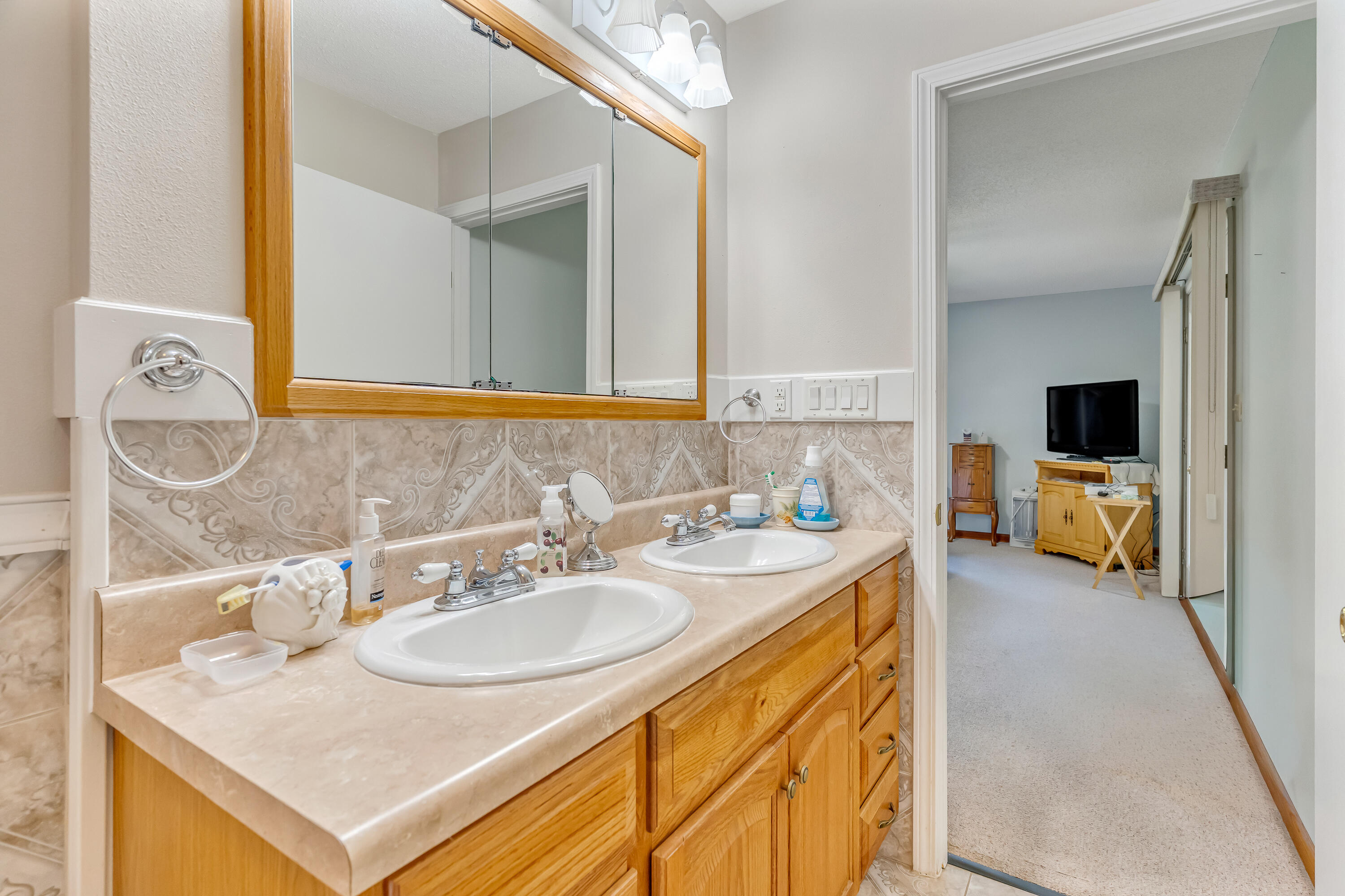 1401 Greenwood Road Baker, FL 32531 - Photo 20 of 61 a bathroom with a sink and a mirror