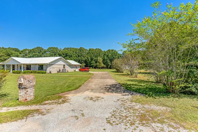 a view of a house with a big yard