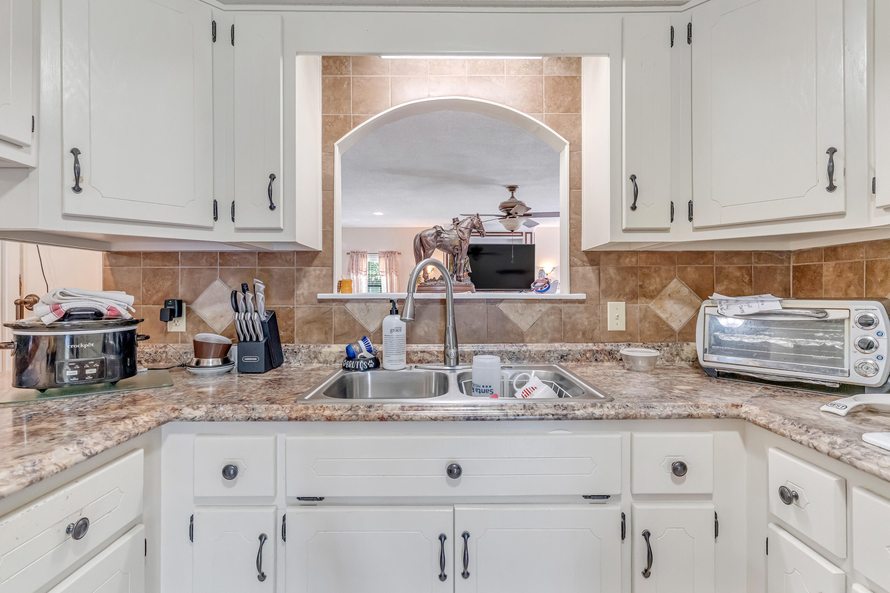1401 Greenwood Road Baker, FL 32531 - Photo 3 of 61 a kitchen with granite countertop white cabinets and a sink