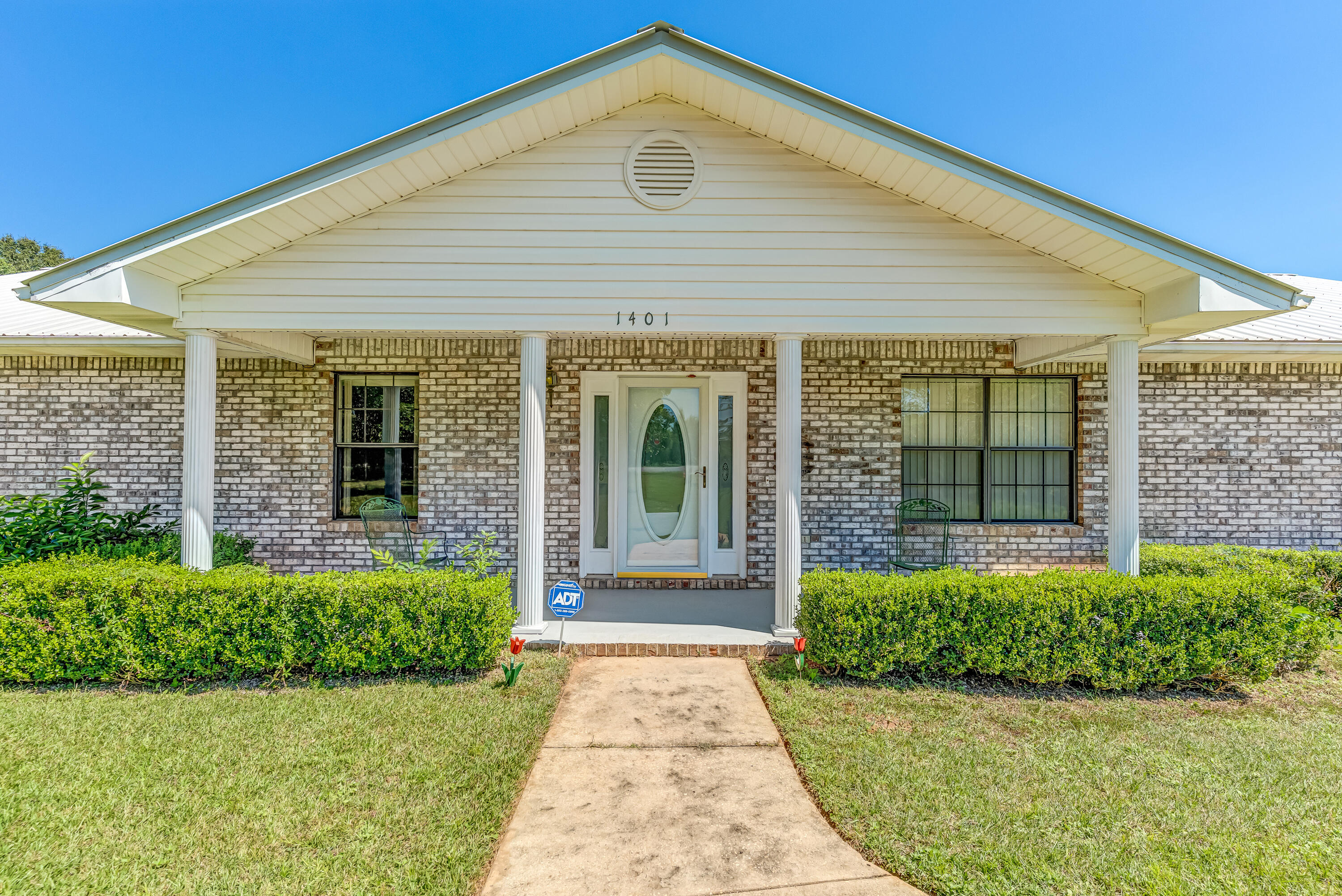 1401 Greenwood Road Baker, FL 32531 - Photo 35 of 61 front view of a house with a yard