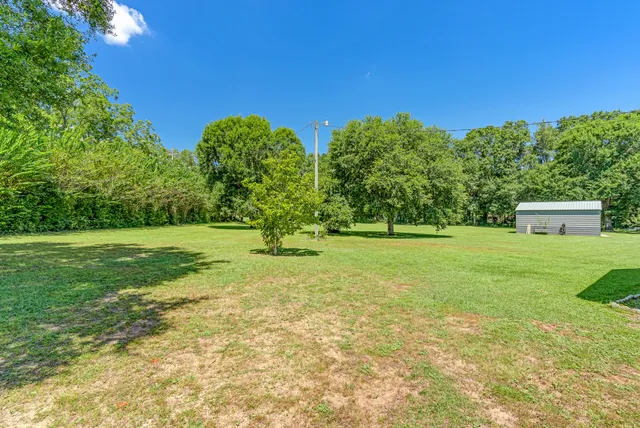 a view of a big room with swimming pool in front of it