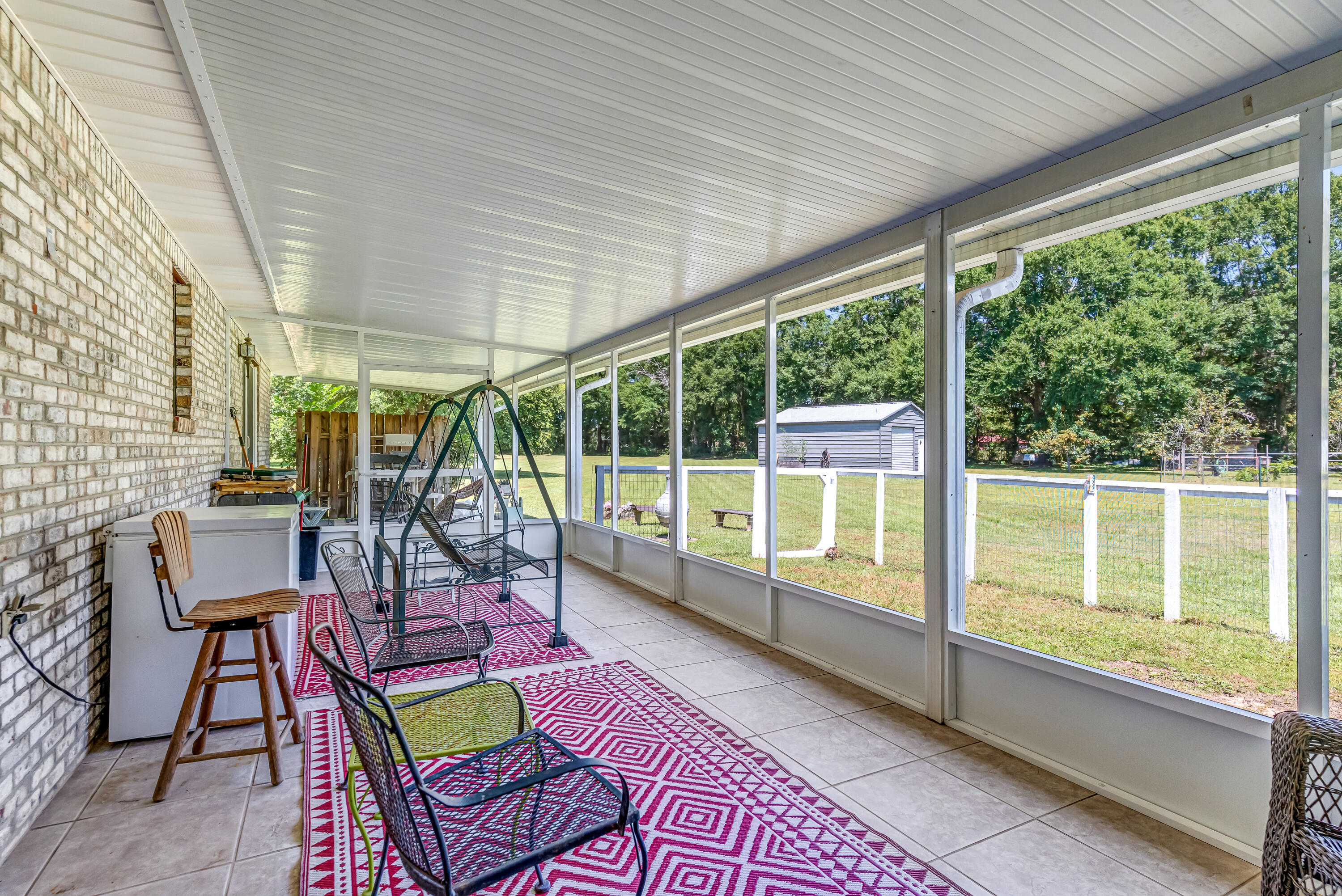 1401 Greenwood Road Baker, FL 32531 - Photo 43 of 61 a house view with a seating space and garden view