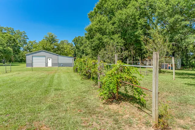 a kitchen with stainless steel appliances granite countertop a stove and cabinets