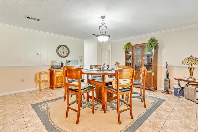 a kitchen with granite countertop cabinets stainless steel appliances a sink and a counter top space