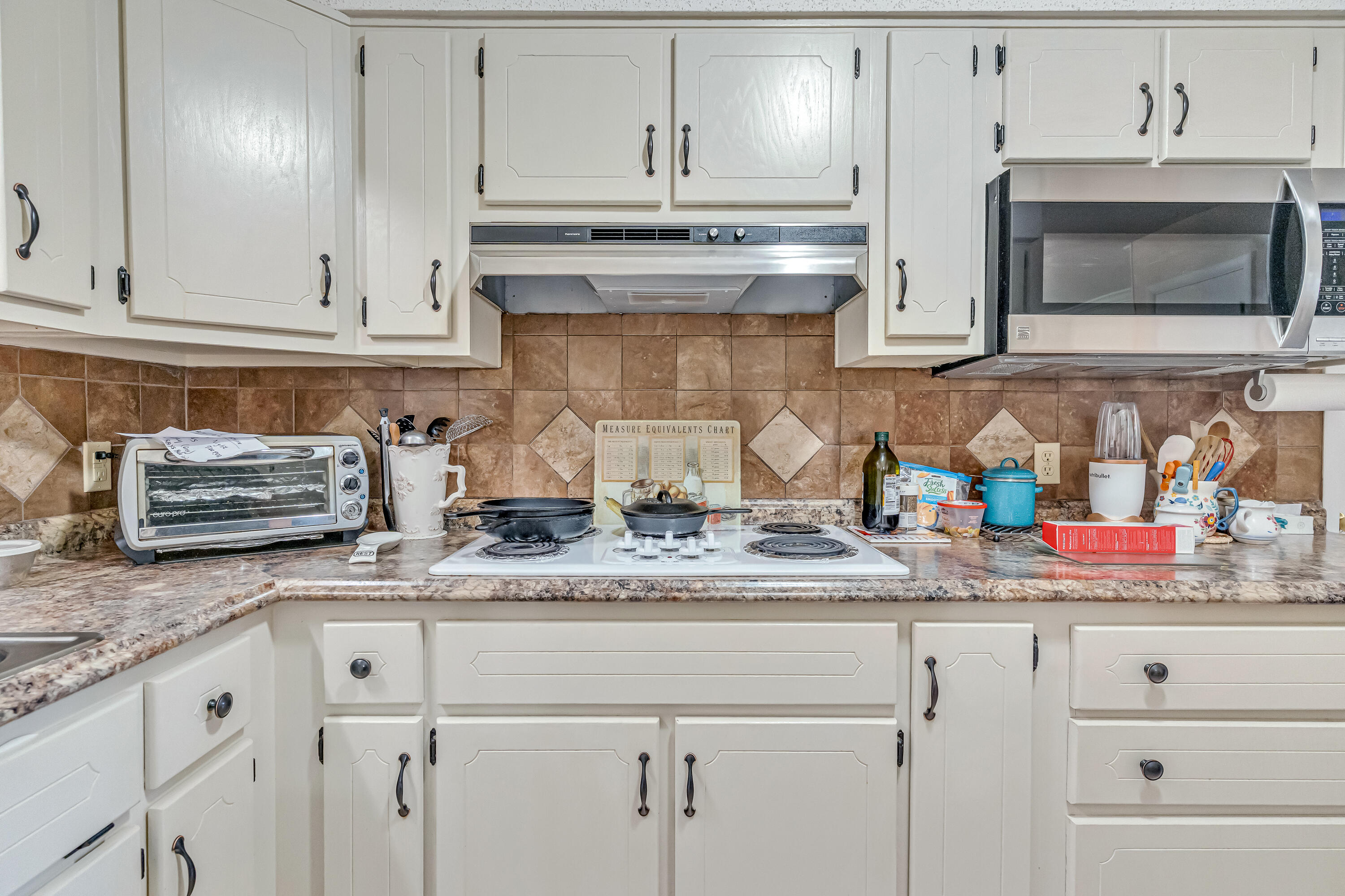 1401 Greenwood Road Baker, FL 32531 - Photo 54 of 61 a kitchen with stainless steel appliances granite countertop white cabinets and a sink