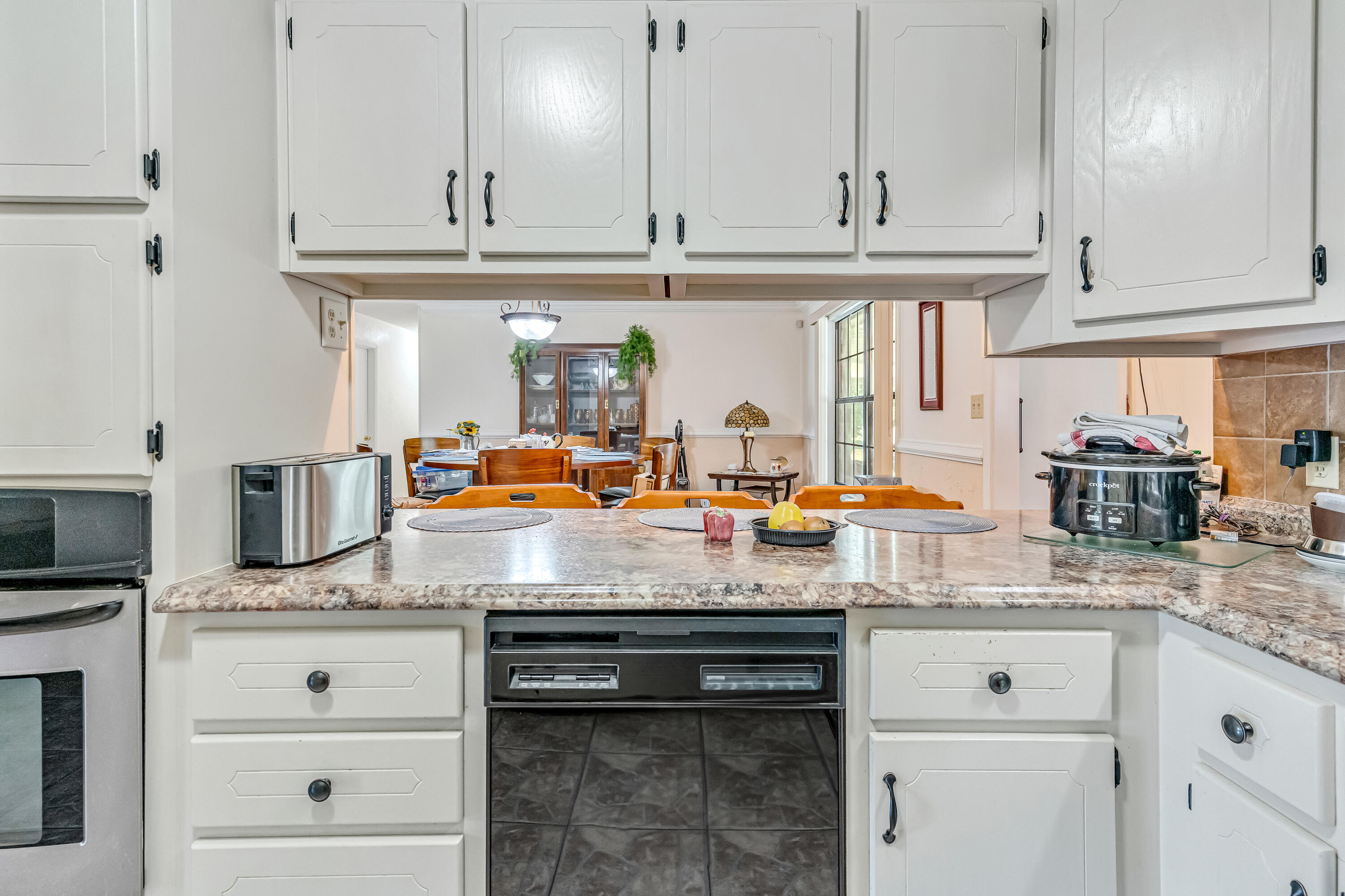 1401 Greenwood Road Baker, FL 32531 - Photo 56 of 61 a kitchen with stainless steel appliances granite countertop a stove and cabinets