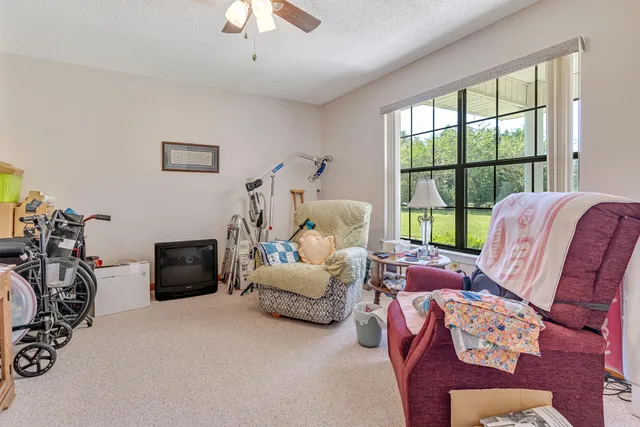a bed room with a bed and a chandelier
