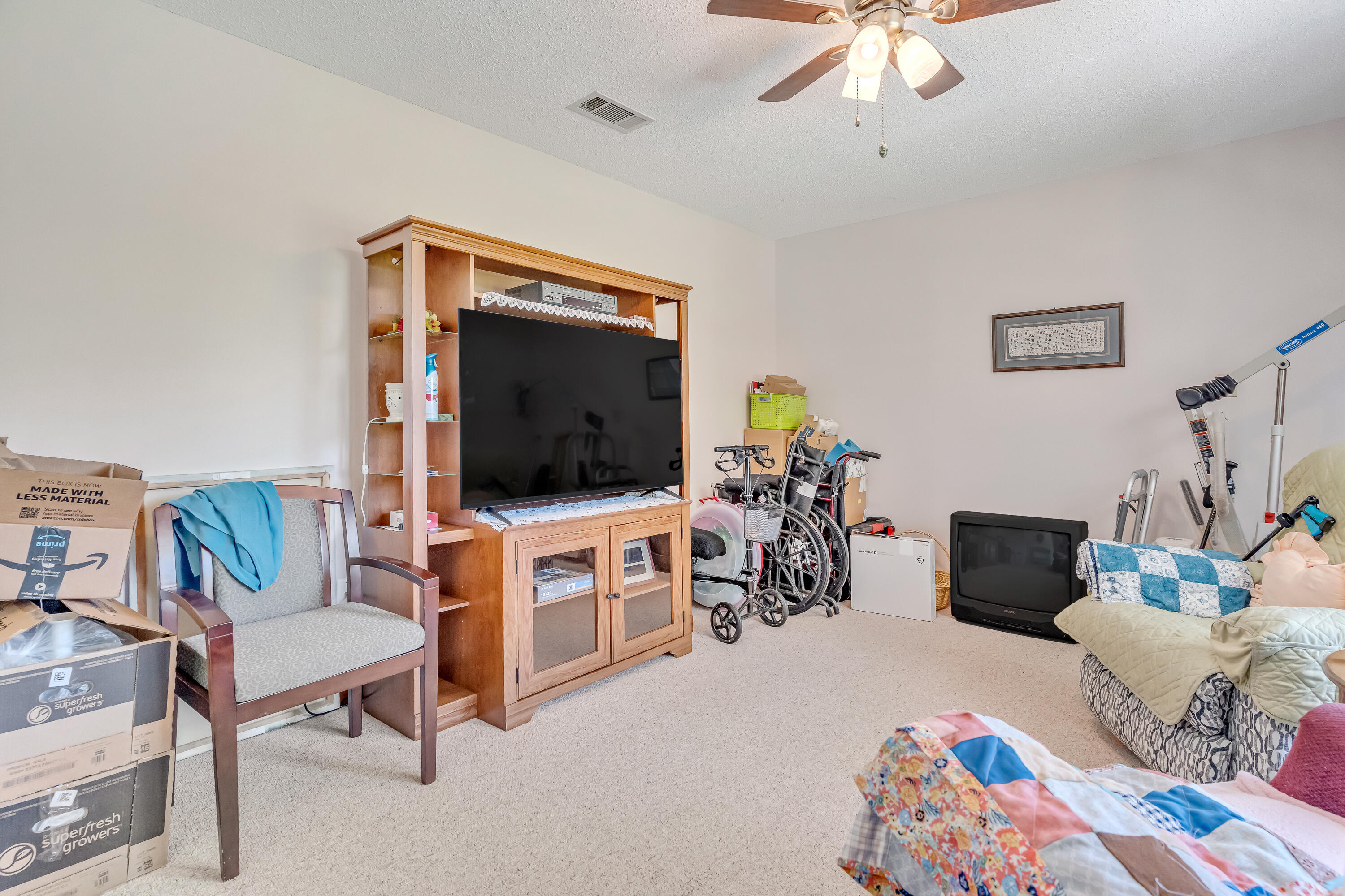 1401 Greenwood Road Baker, FL 32531 - Photo 10 of 61 a living room with furniture and a flat screen tv