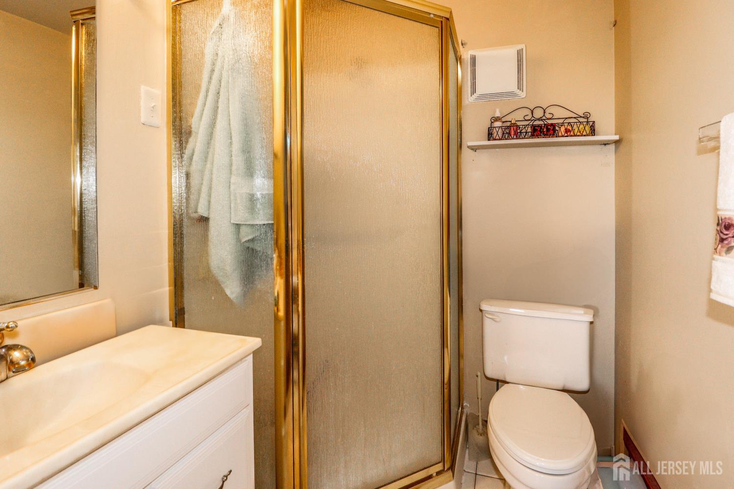 40 Fayette Street, Unit 57 Perth Amboy, NJ 08861 - Photo 19 of 33 a bathroom with a toilet a sink and a shower